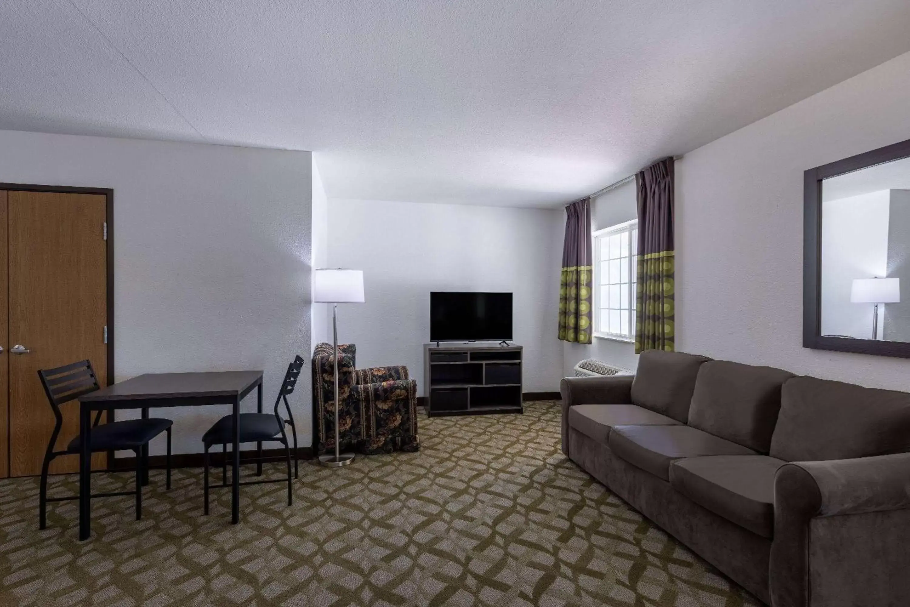 Bed, Seating Area in Super 8 by Wyndham De Soto