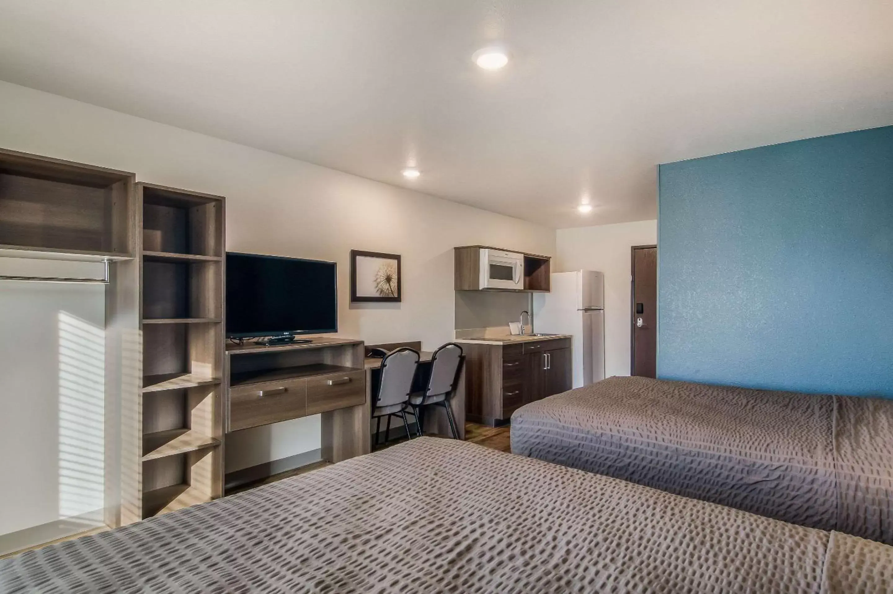 Photo of the whole room, TV/Entertainment Center in WoodSpring Suites Broomfield-Westminster