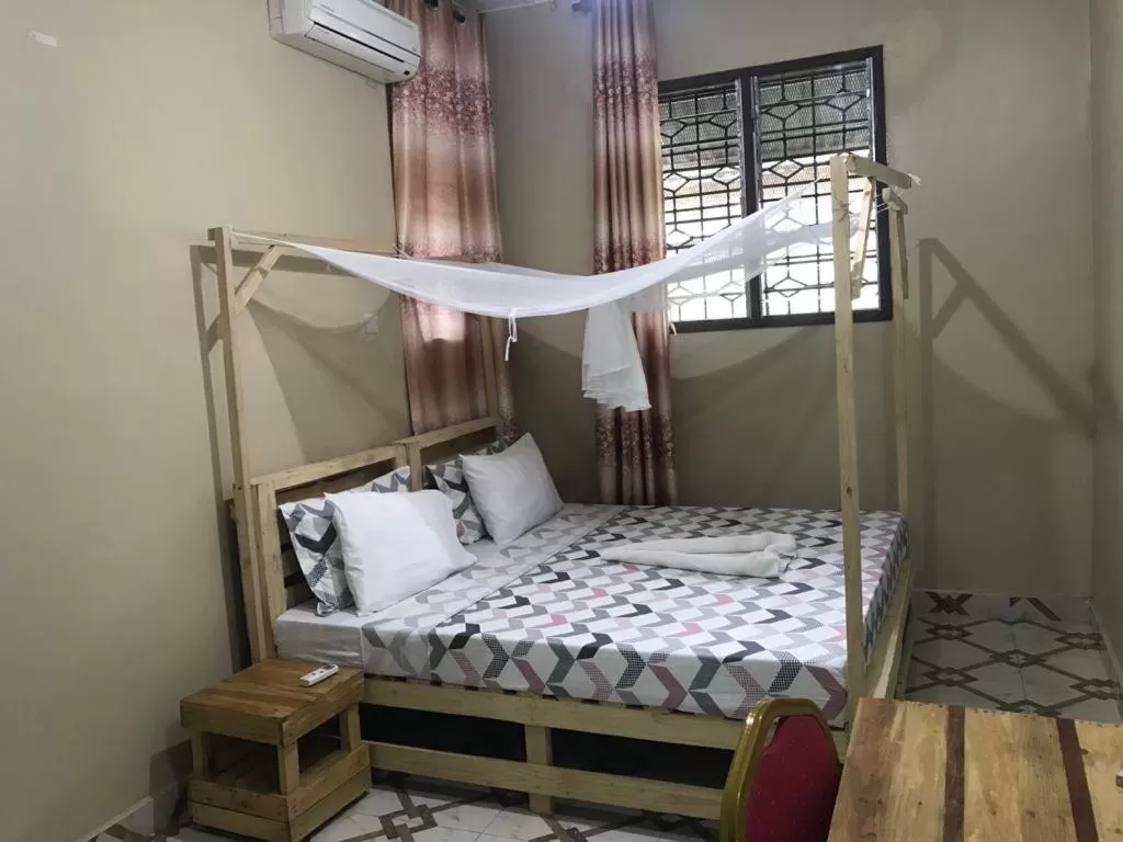 Photo of the whole room, Bed in L&J Modern Backpackers Kinondoni