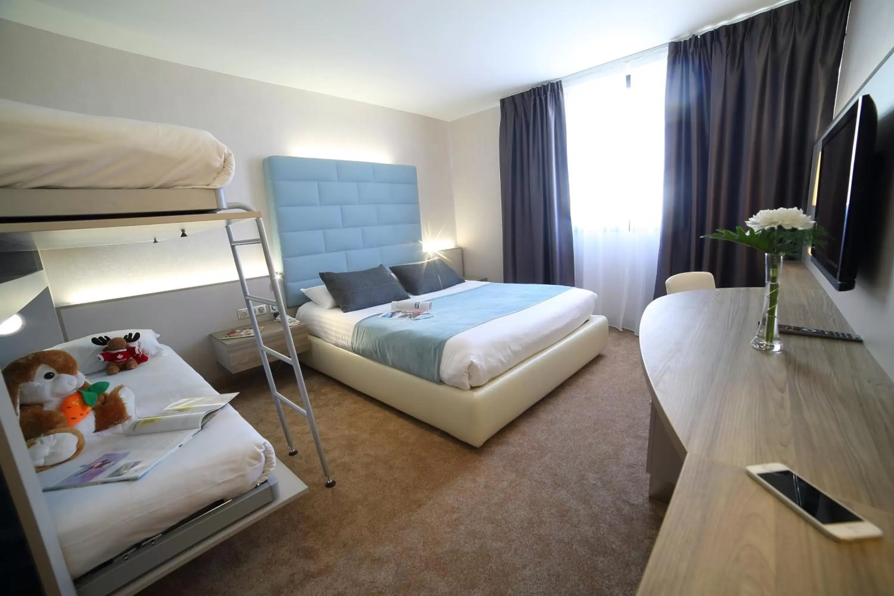 Photo of the whole room, Bed in Hotel Plaza - site du Futuroscope Photo of the whole room, Bed in Hotel Plaza - site du Futuroscope