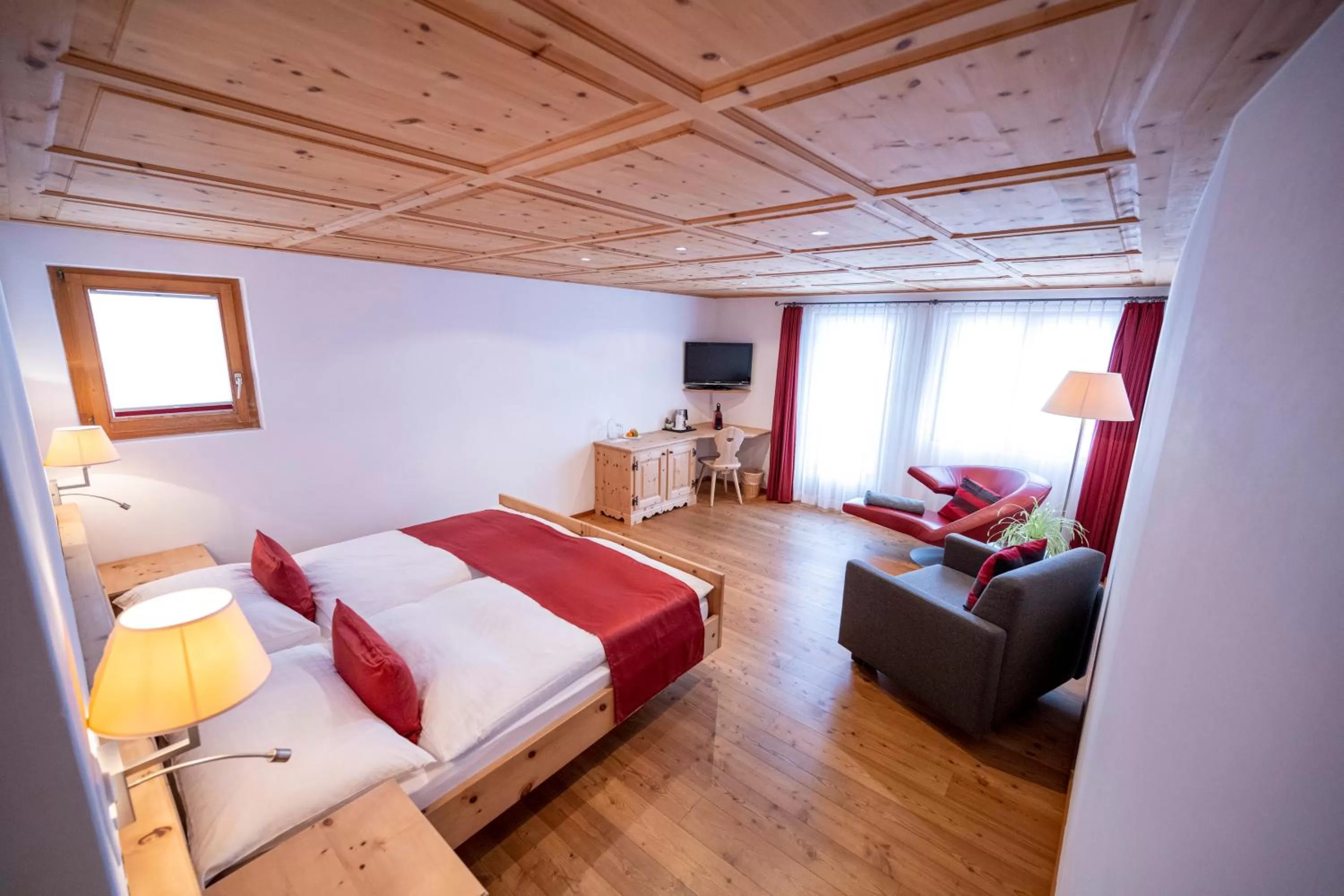 Seating area, Bed in Hotel Engiadina