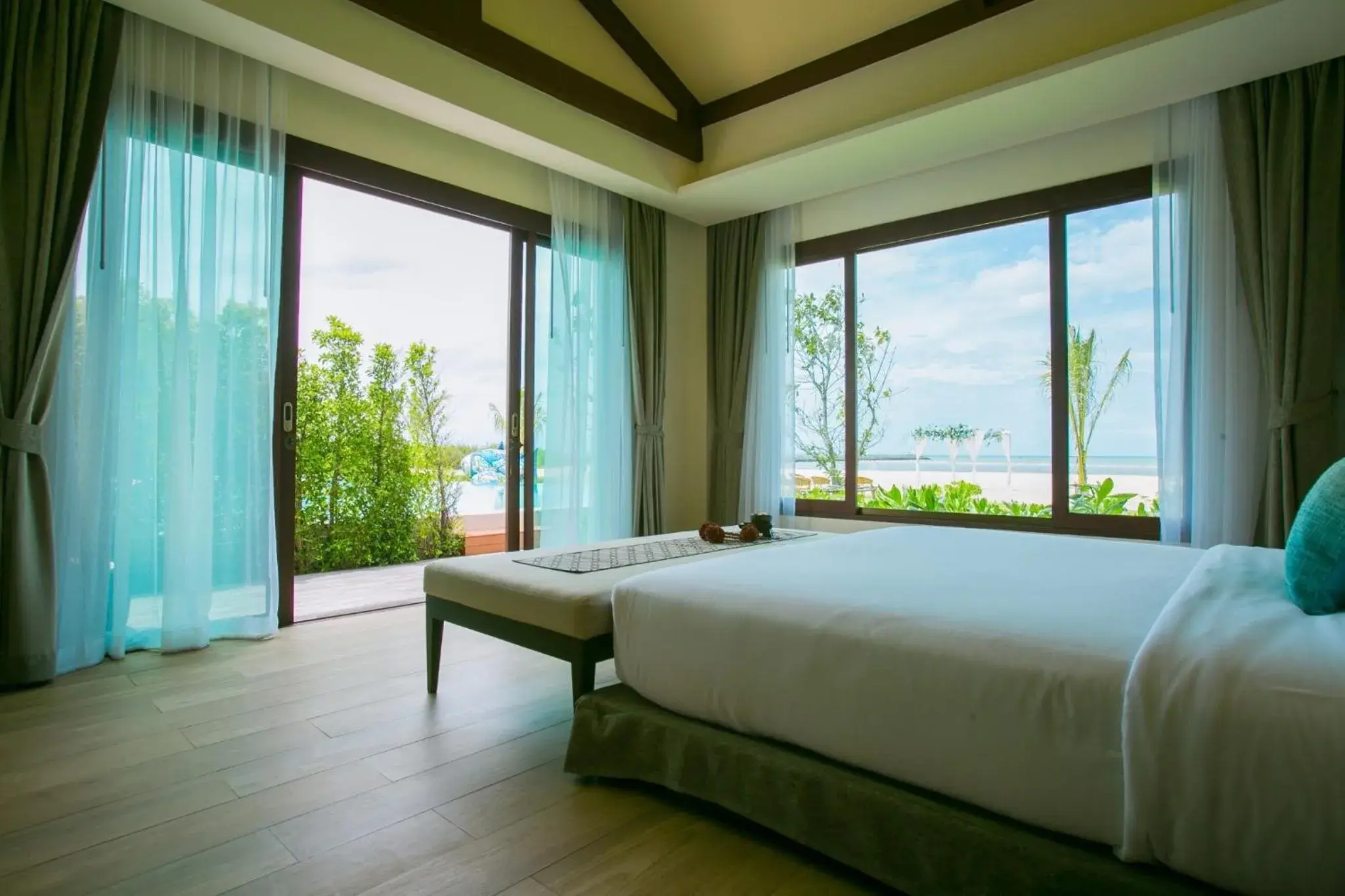 Bed in Triple Tree Beach Resort