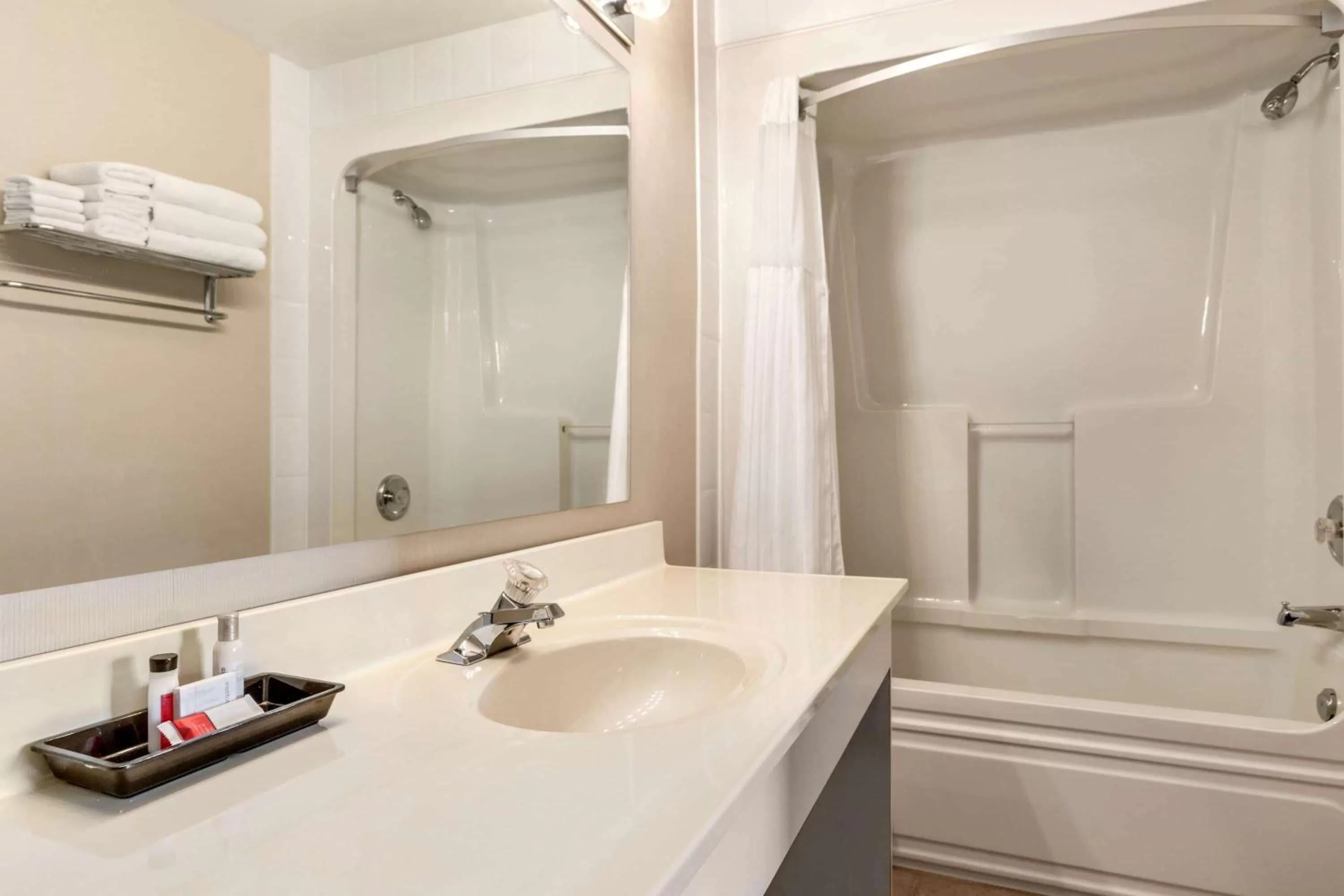 Bathroom in Travelodge Hotel by Wyndham Kingston Lasalle