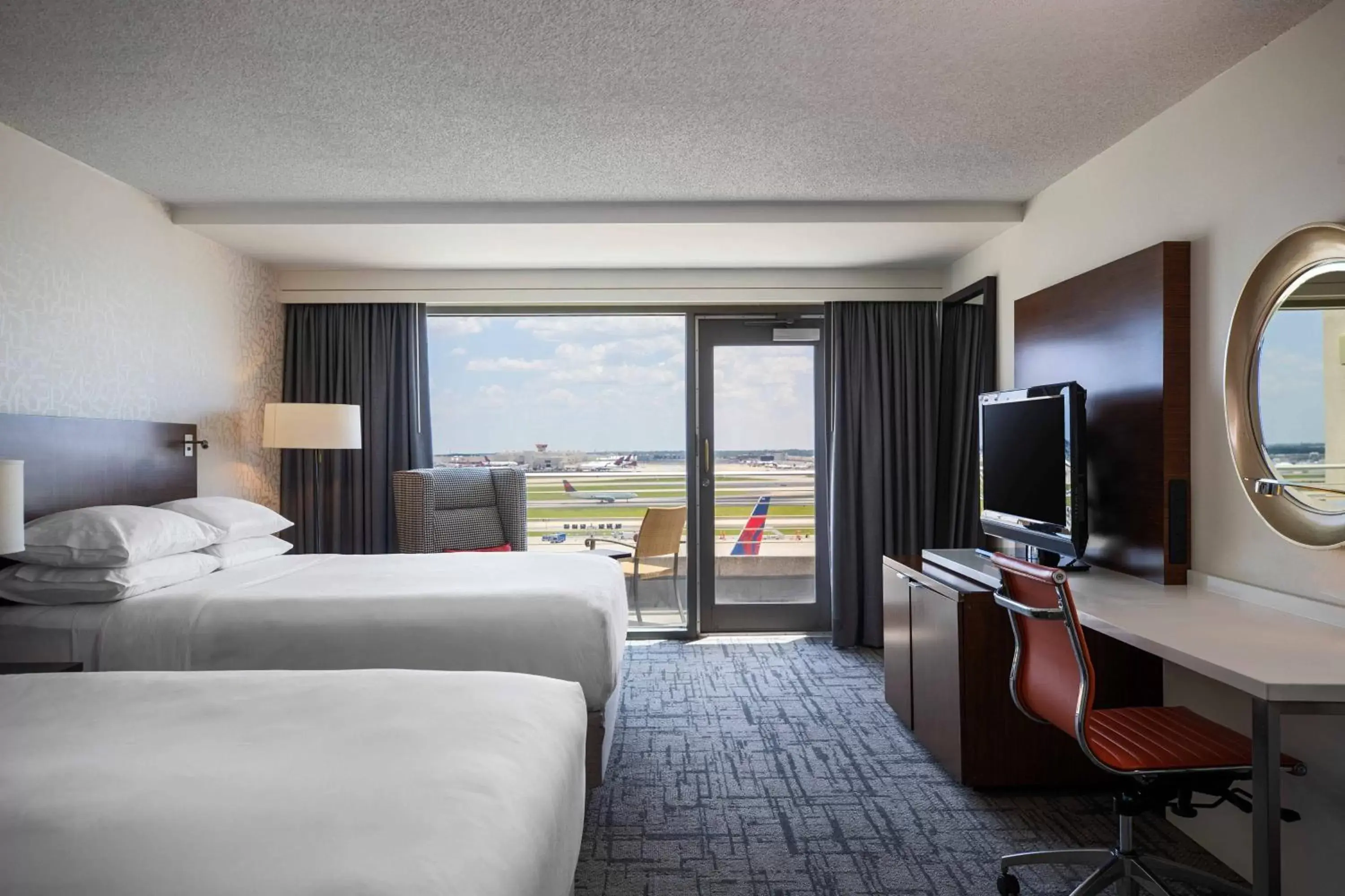 Photo of the whole room, TV/Entertainment Center in Renaissance Concourse Atlanta Airport Hotel