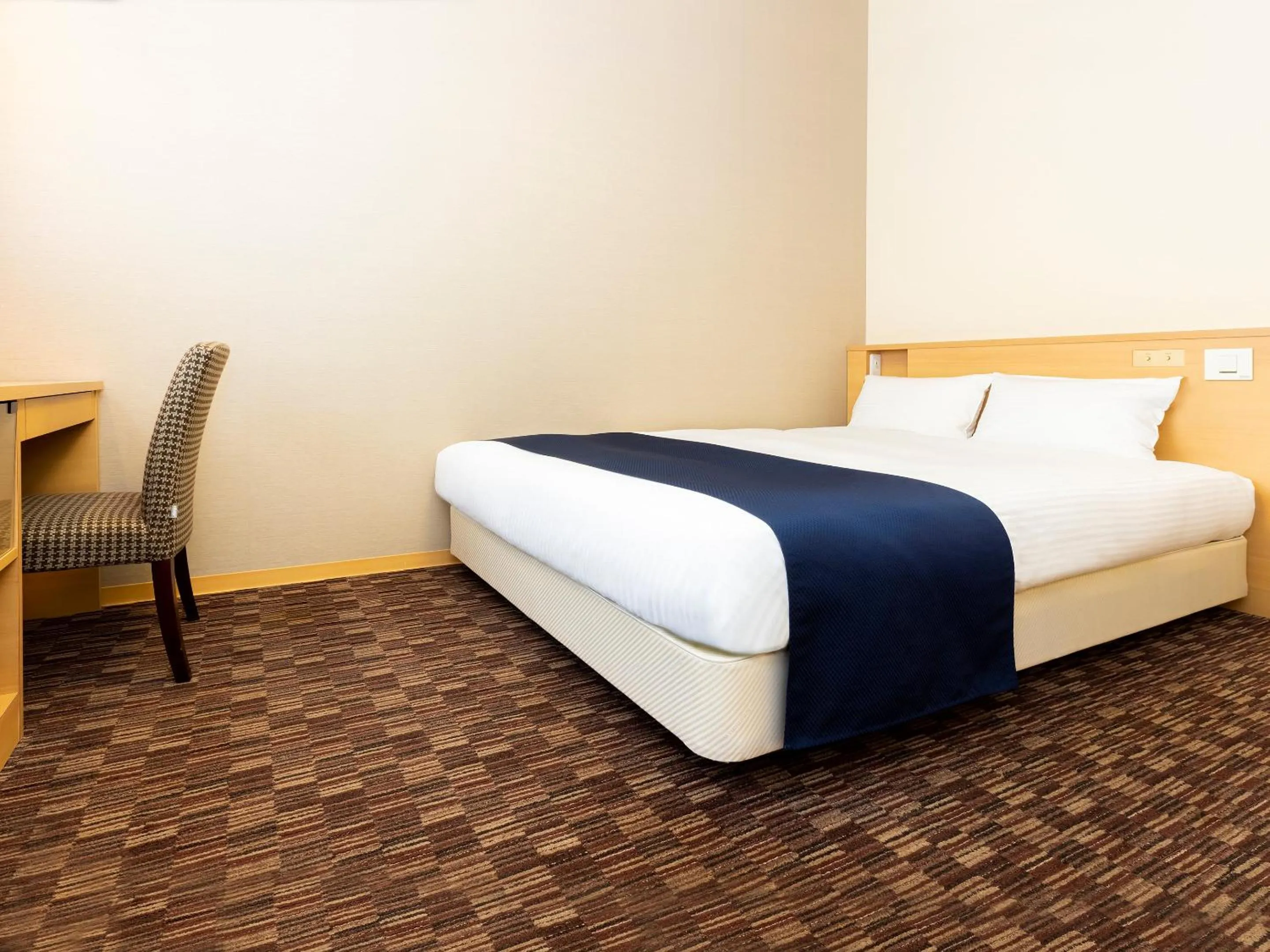 Bed in Hotel WBF Grande Asahikawa