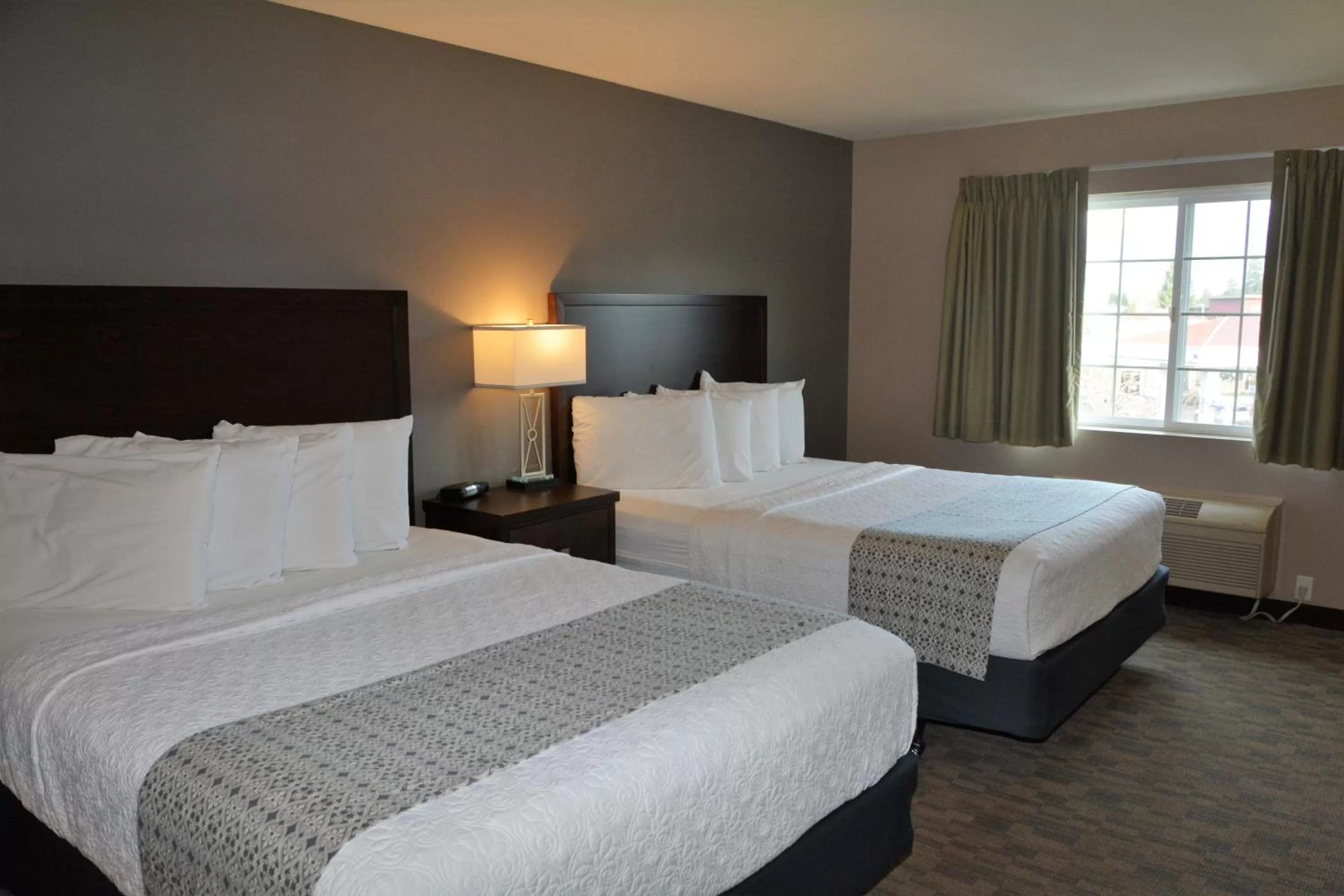 Bed in FairBridge Inn & Suites DuPont