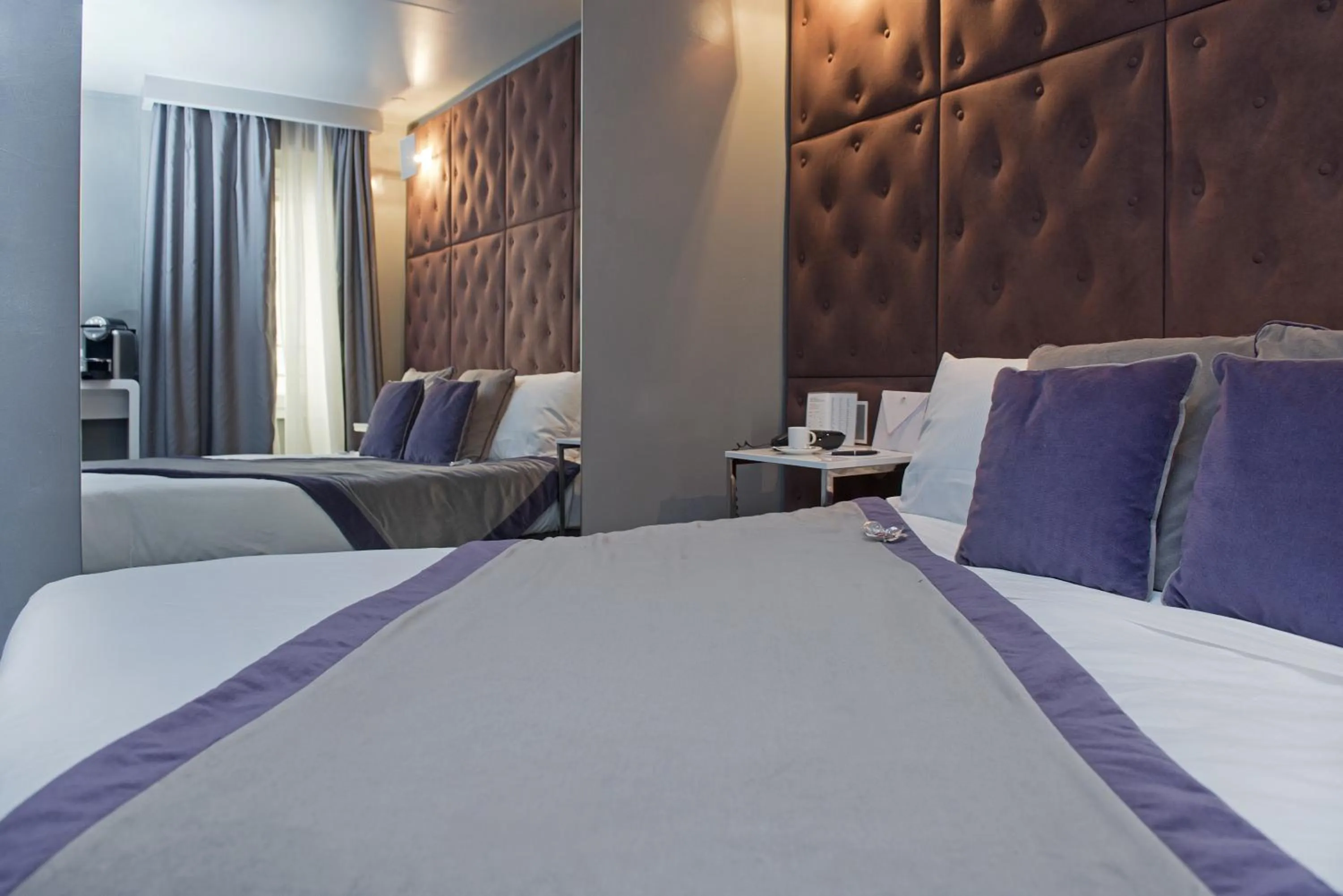 Decorative detail, Bed in Torre Argentina Relais - Residenze di Charme