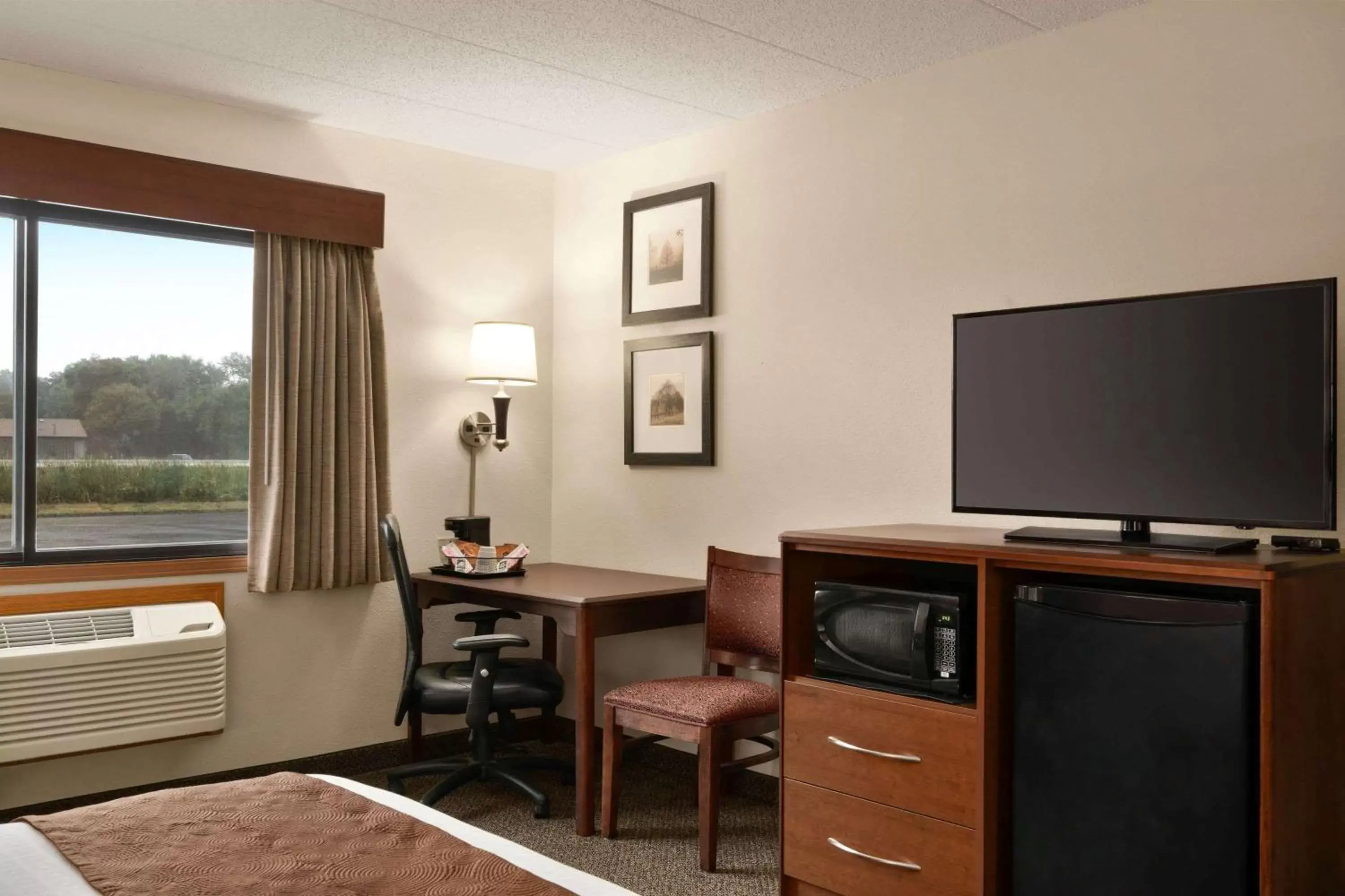 Photo of the whole room, TV/Entertainment Center in AmericInn by Wyndham Virginia