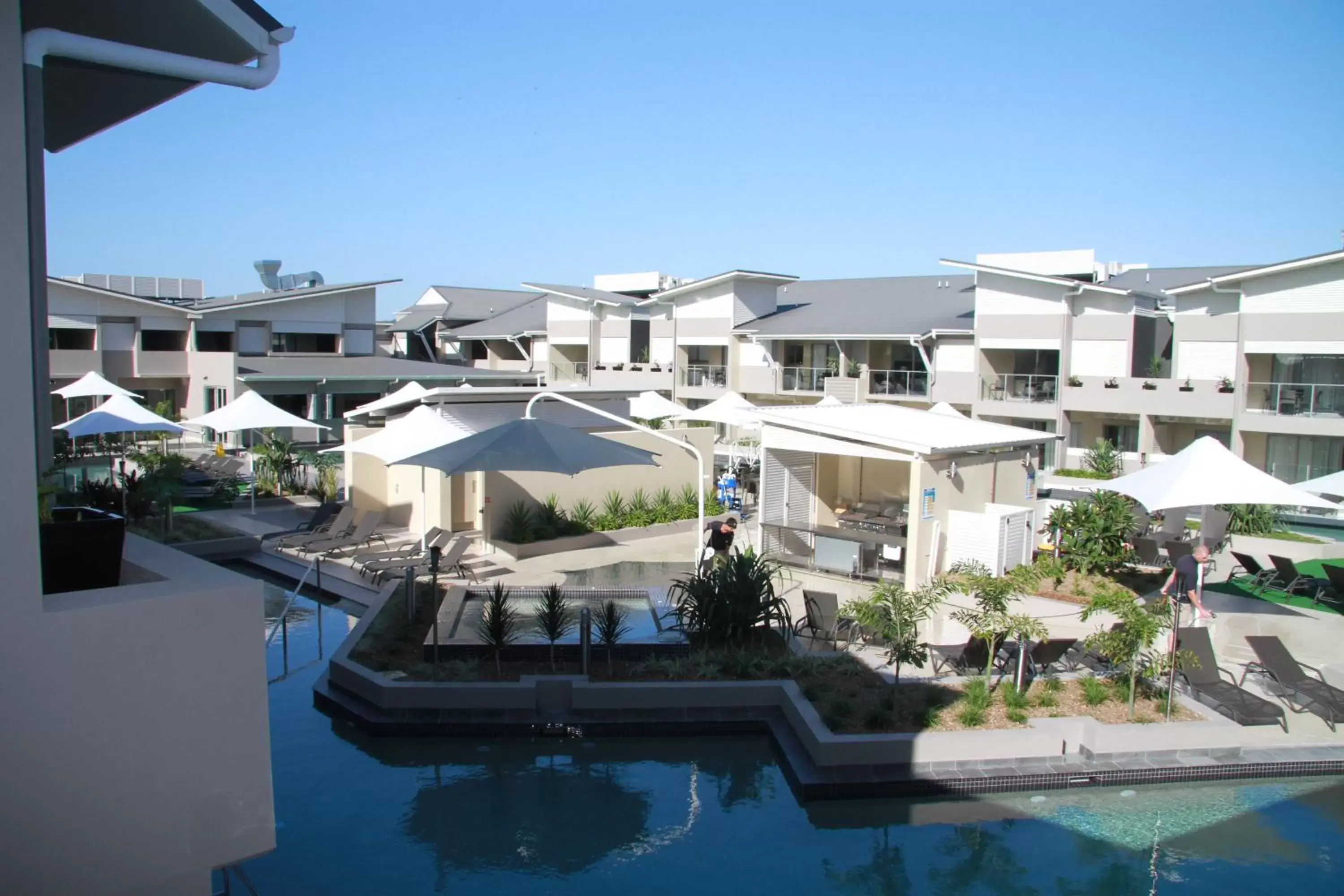 Balcony/Terrace, Pool View in 1770 Lagoons Central Apartment Resort