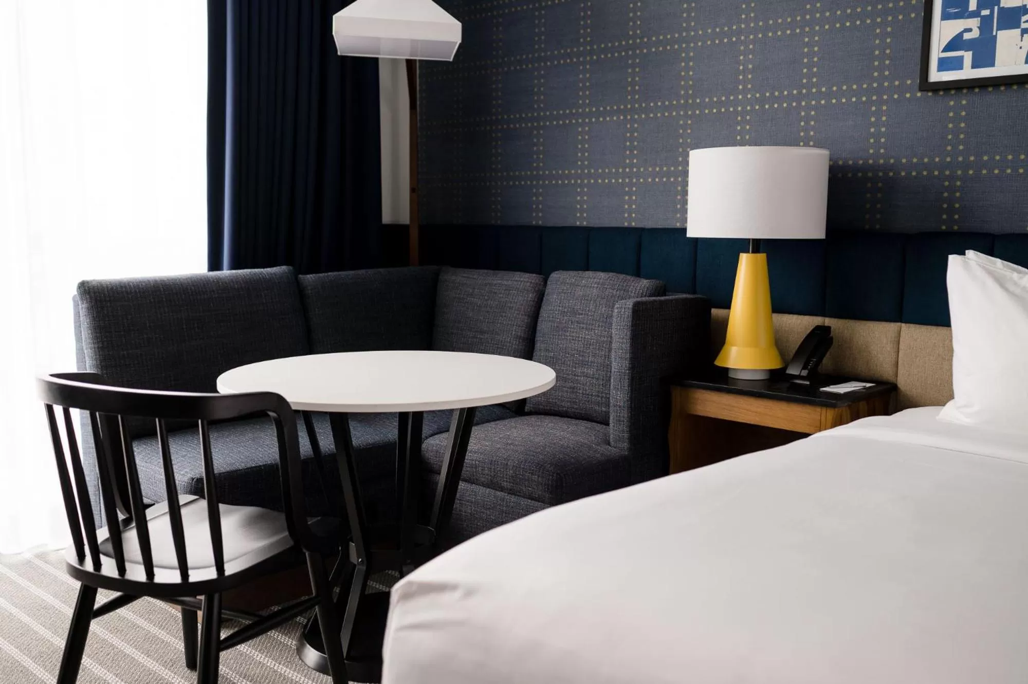 Seating area, Bed in Cambria Hotel Boston Somerville