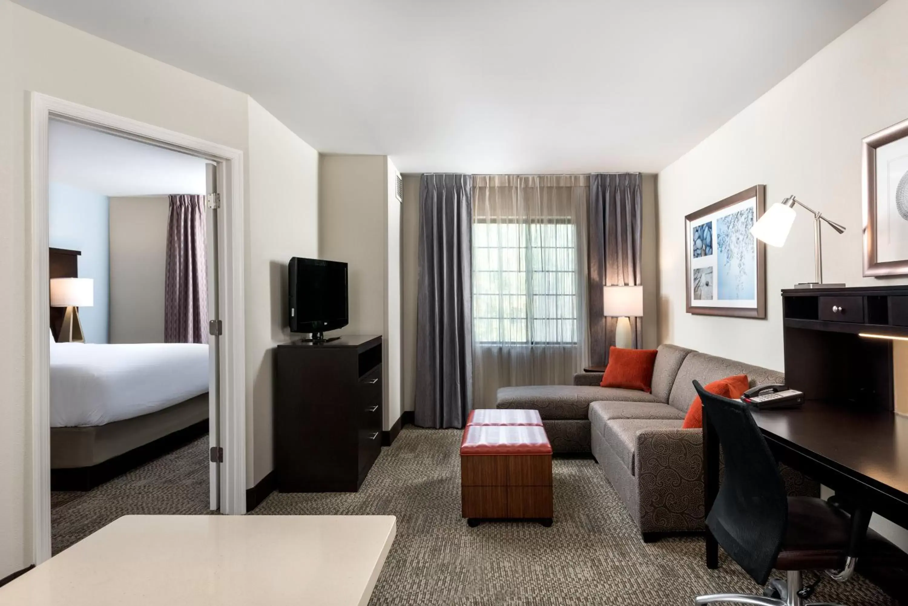 Bedroom, TV/Entertainment Center in Staybridge Suites Chantilly Dulles Airport, an IHG Hotel