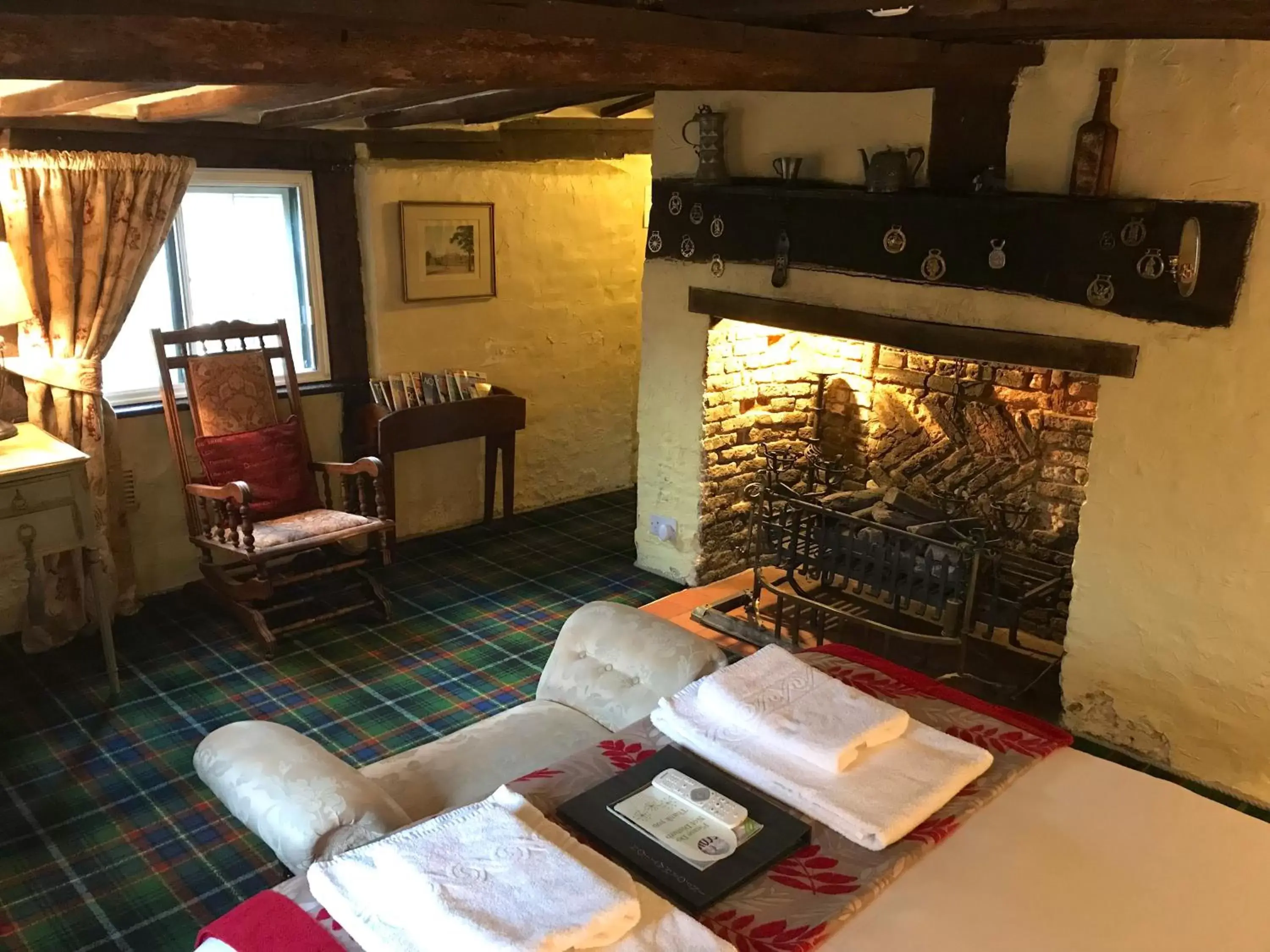 Bed, Seating Area in Thatched Cottage Hotel