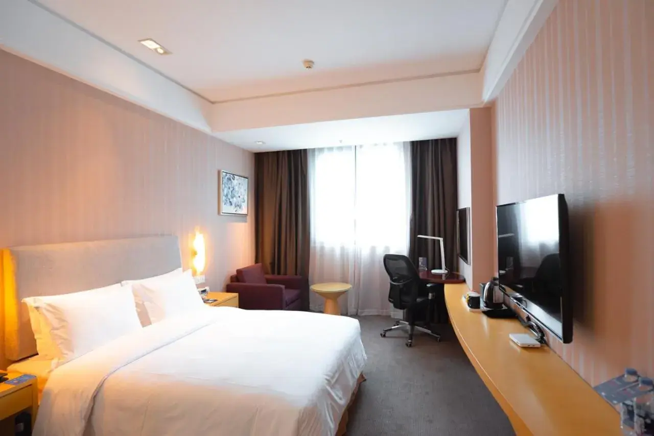 Bed in Holiday Inn Express Nantong Xinghu, an IHG Hotel
