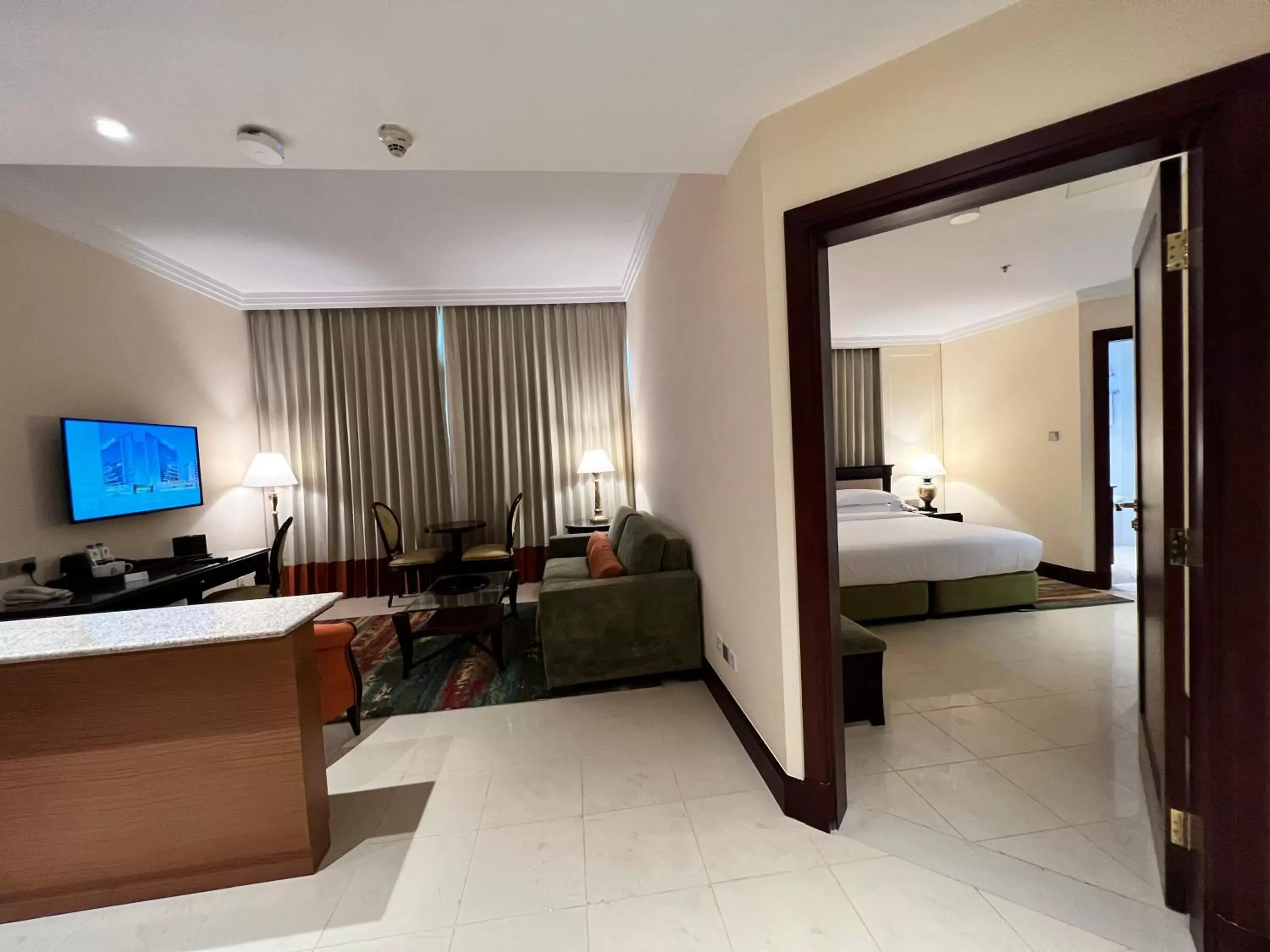 Living room, TV/Entertainment Center in City Seasons Suites