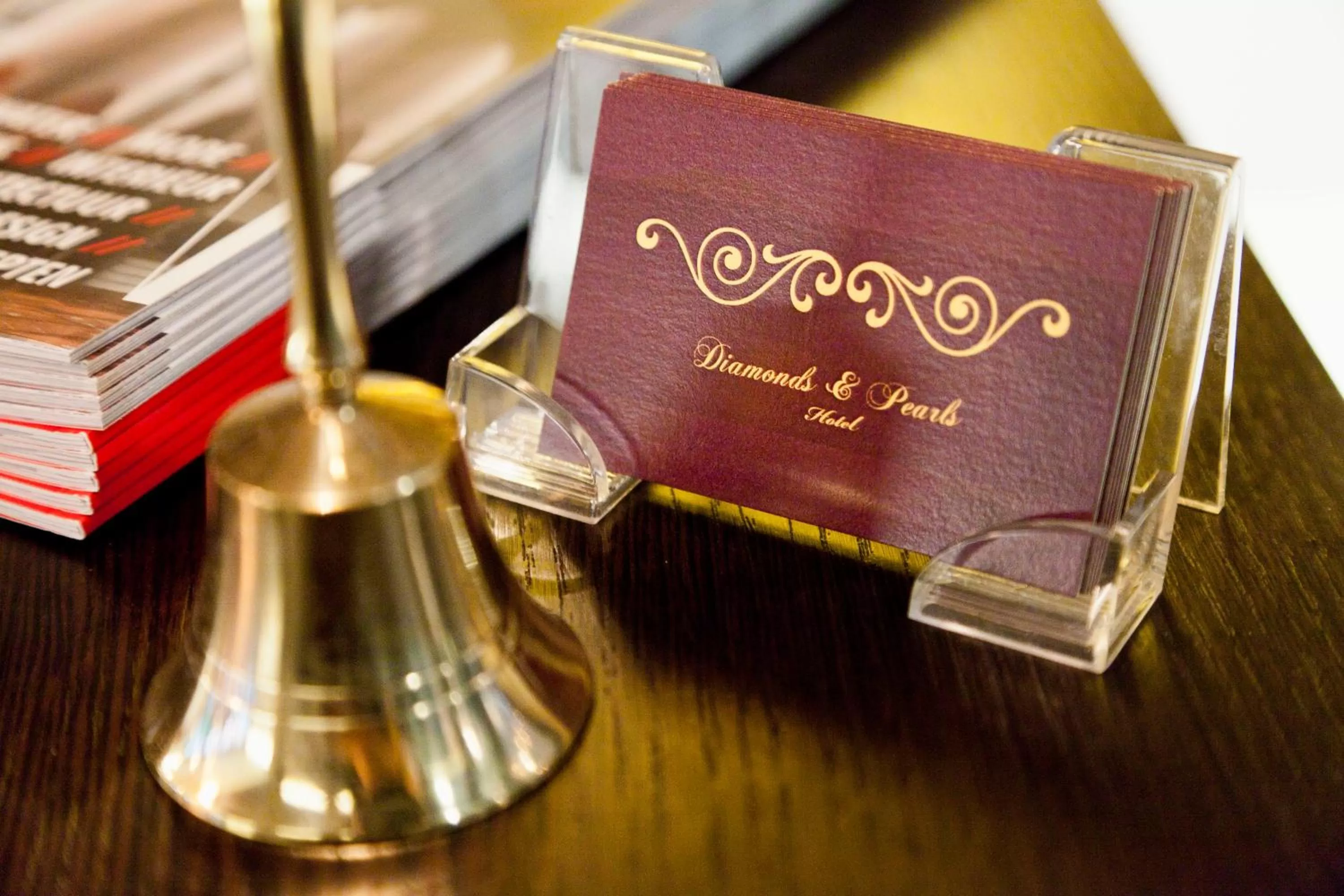 Property logo or sign in Hotel Diamonds and Pearls