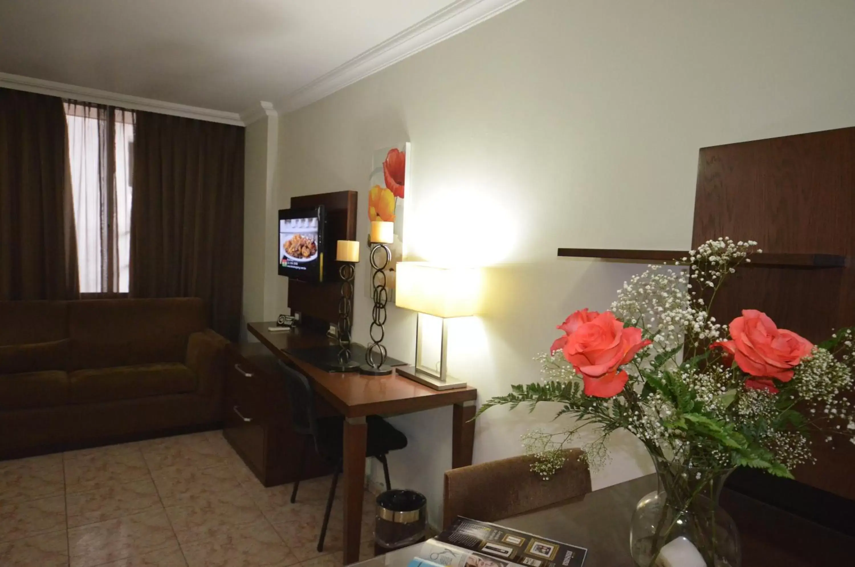 Bedroom, TV/Entertainment Center in Hotel Coral Suites