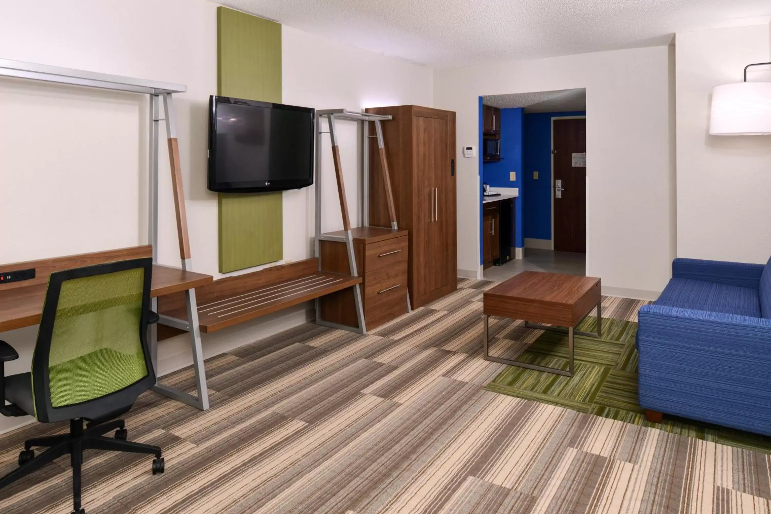 Photo of the whole room, TV/Entertainment Center in Holiday Inn Express & Suites Raleigh NE - Medical Ctr Area, an IHG Hotel