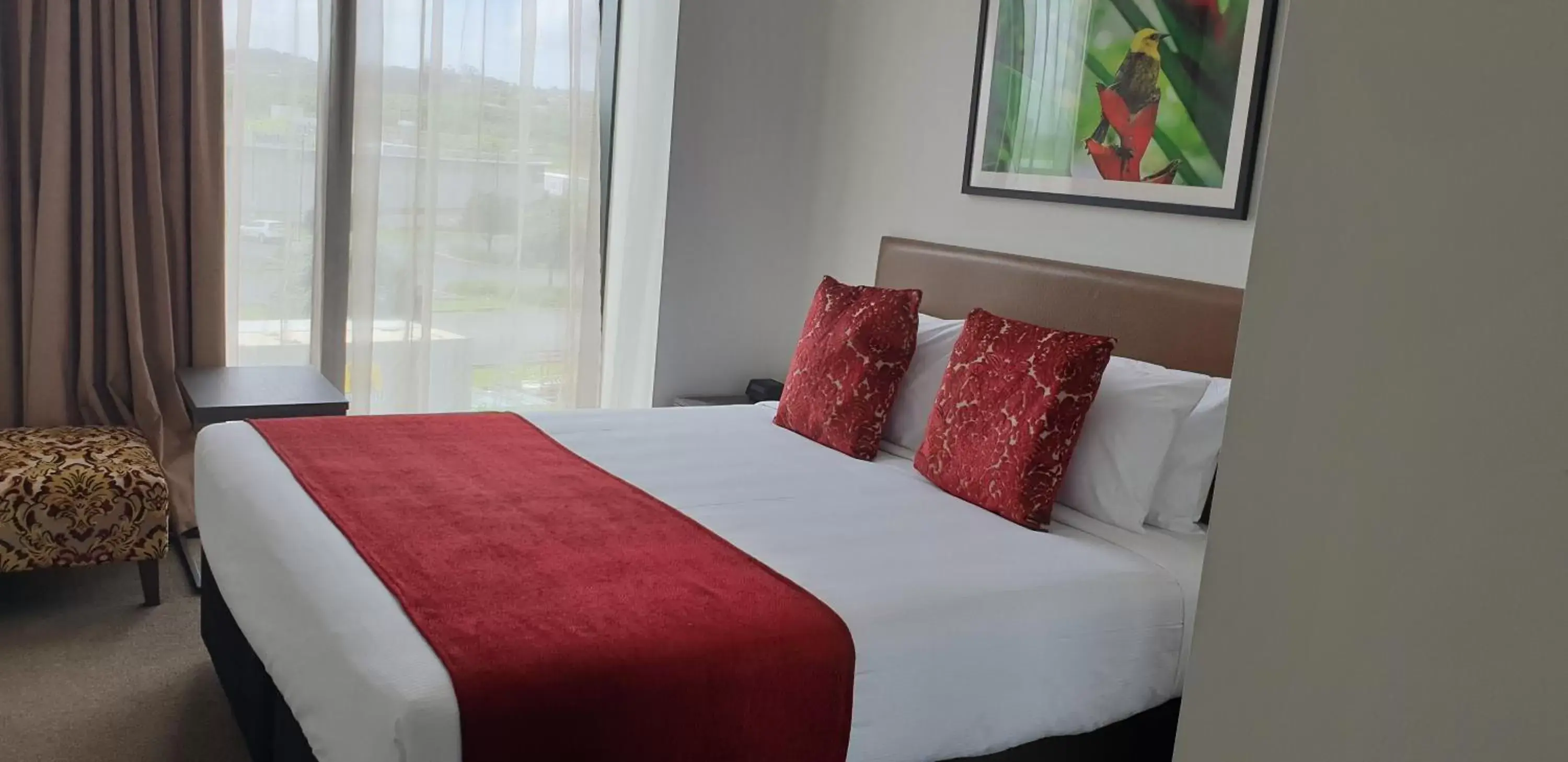 Bed in Ramada Suites by Wyndham Manukau