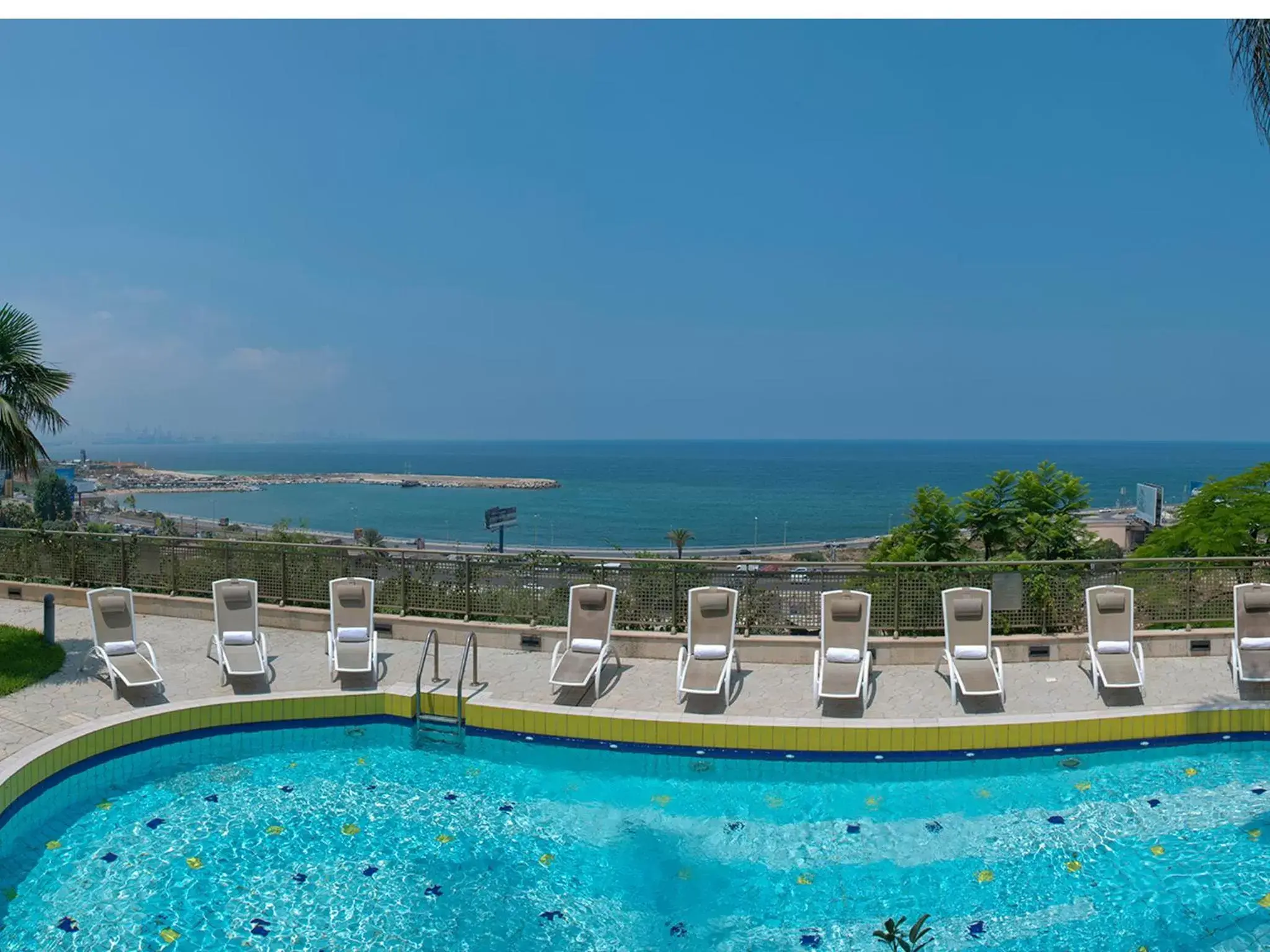 Balcony/Terrace, Swimming Pool in Le Royal Beirut