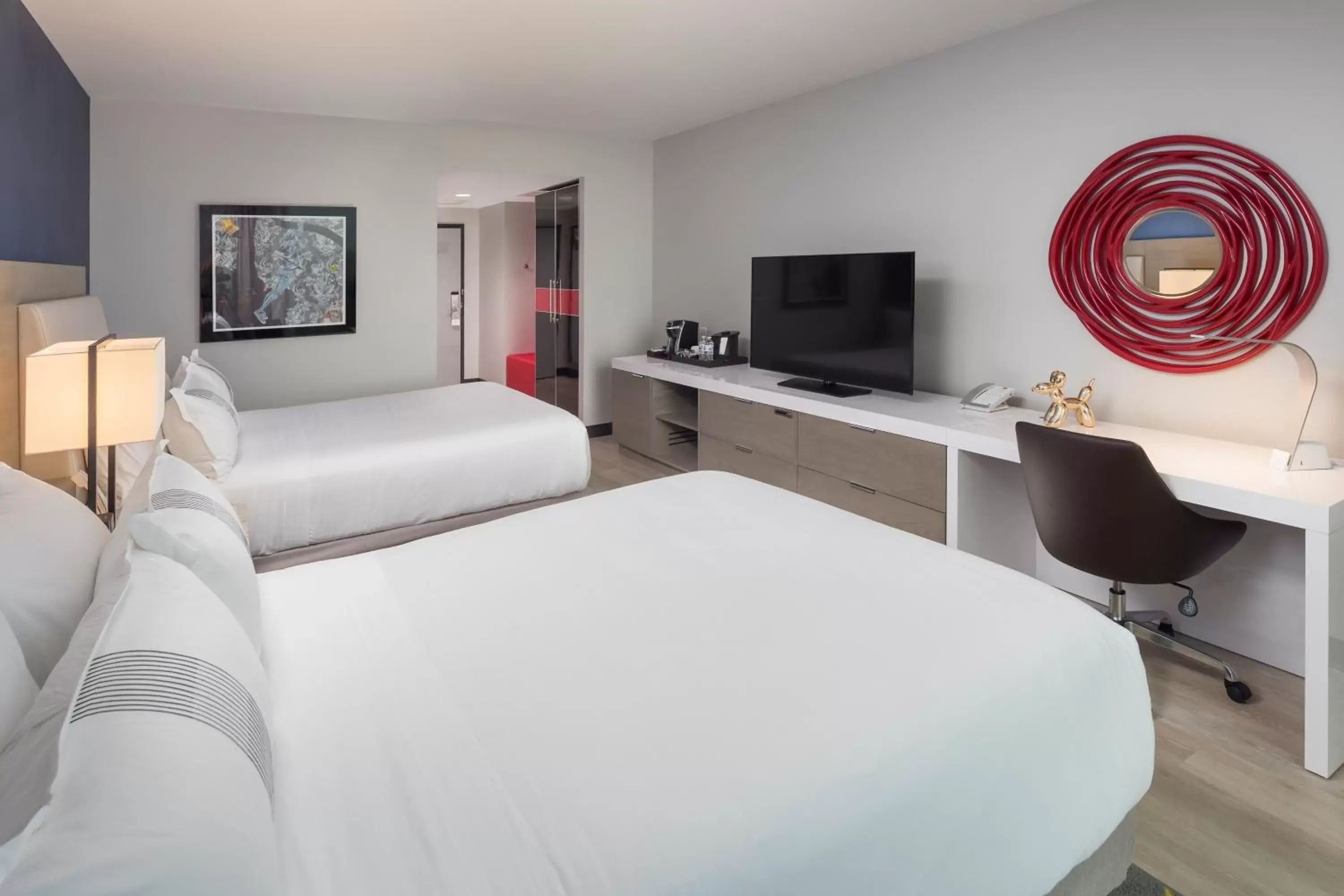 Bedroom, TV/Entertainment Center in The Summit Hotel