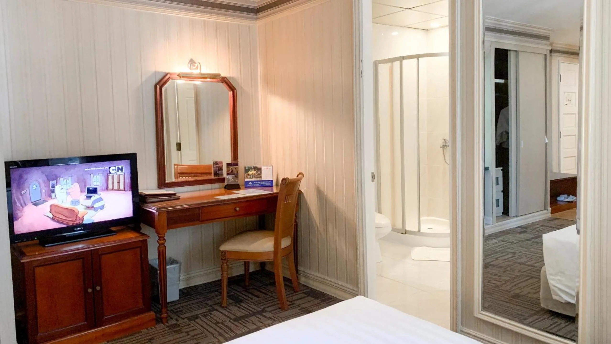 Living room, Bed in Lotus Saigon Hotel