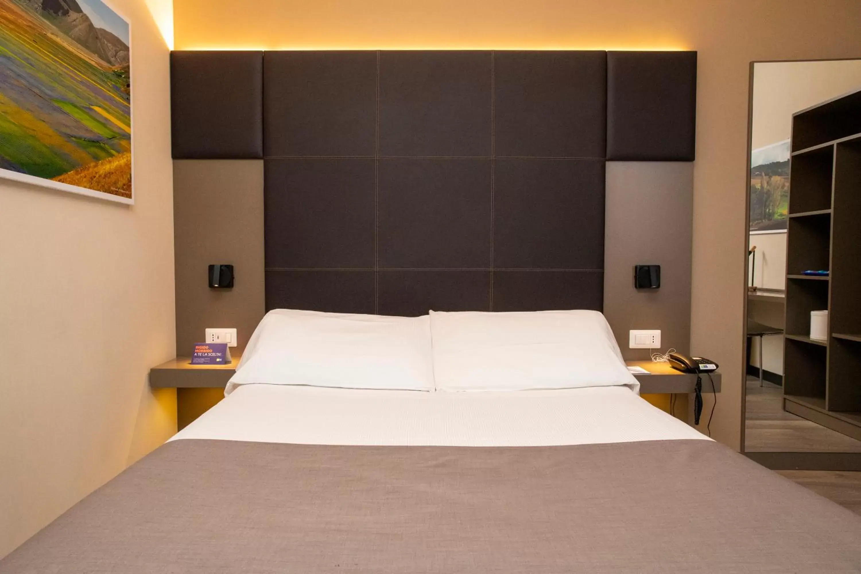 Bed in City Hotel & Suites