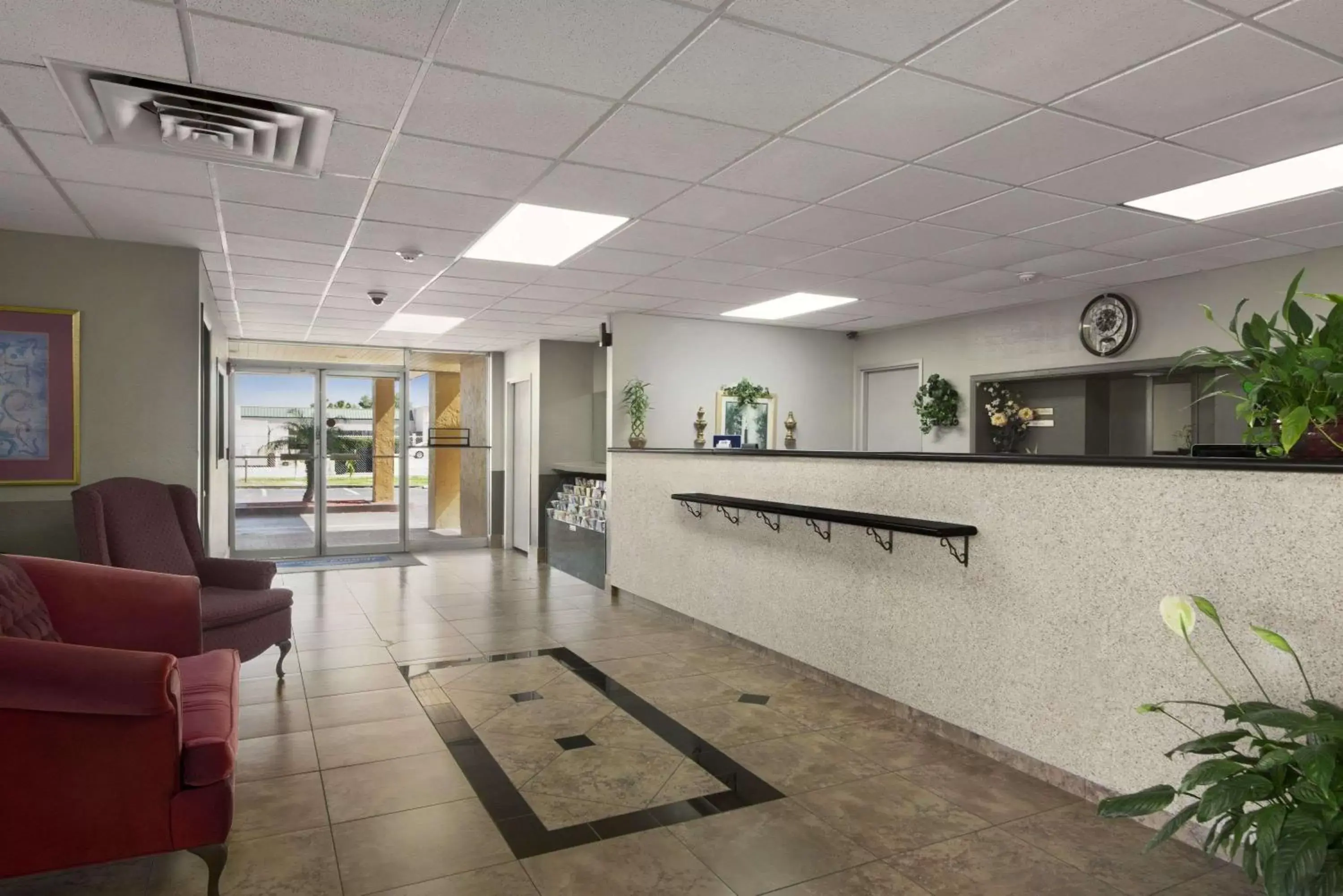 Lobby or reception, Lobby/Reception in Howard Johnson by Wyndham Winter Haven FL