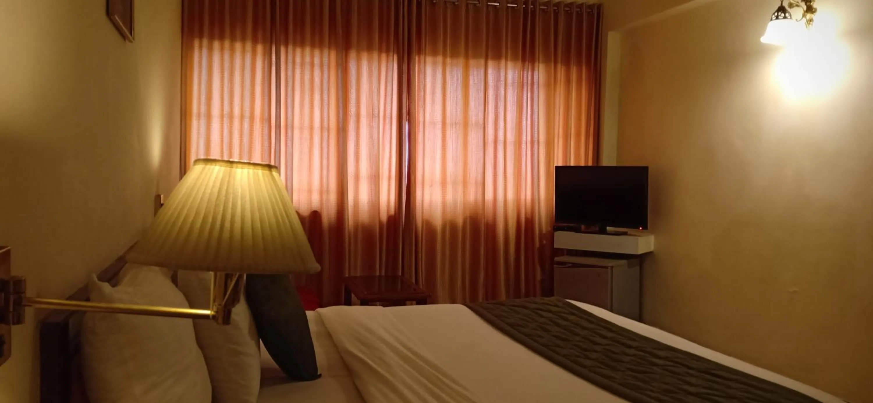 Bedroom, Bed in Hotel Poonja International