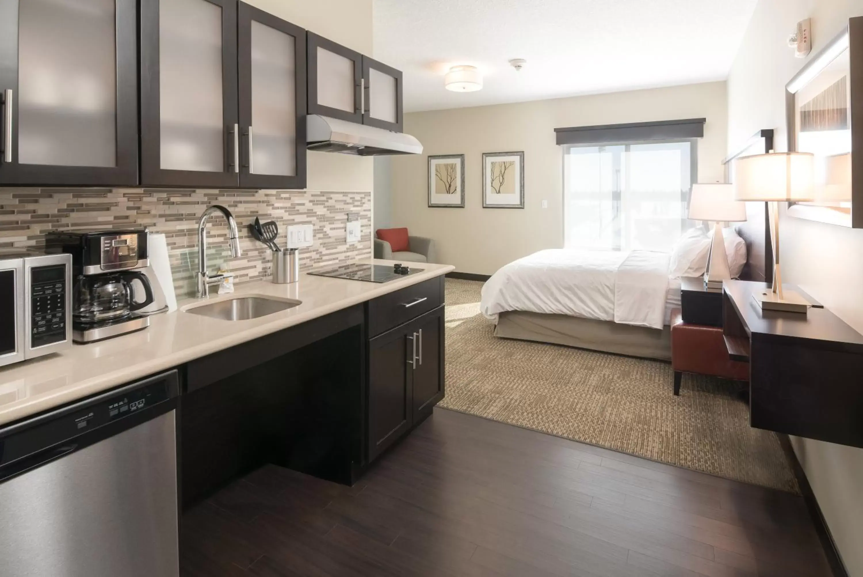 Photo of the whole room, Kitchen/Kitchenette in Staybridge Suites - Saskatoon - University, an IHG Hotel