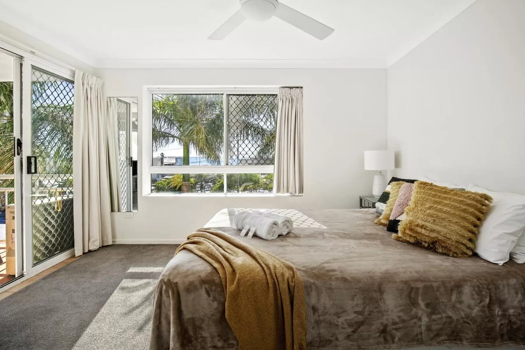 Bed in Kirra Palms Holiday Apartments