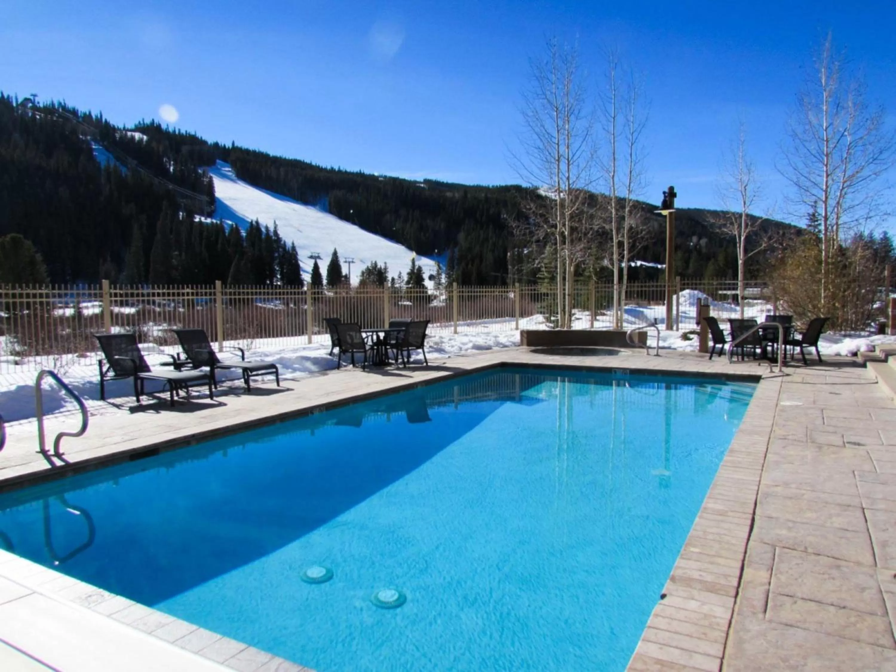 Swimming pool in Red Hawk Lodge by Summit County Mountain Retreats