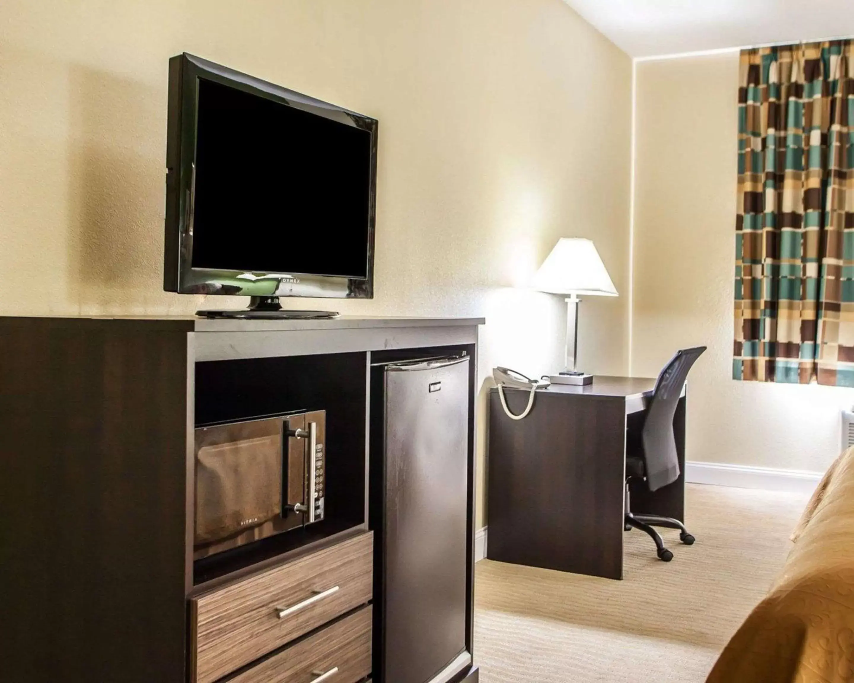 Photo of the whole room, TV/Entertainment Center in Quality Inn & Suites Champaign