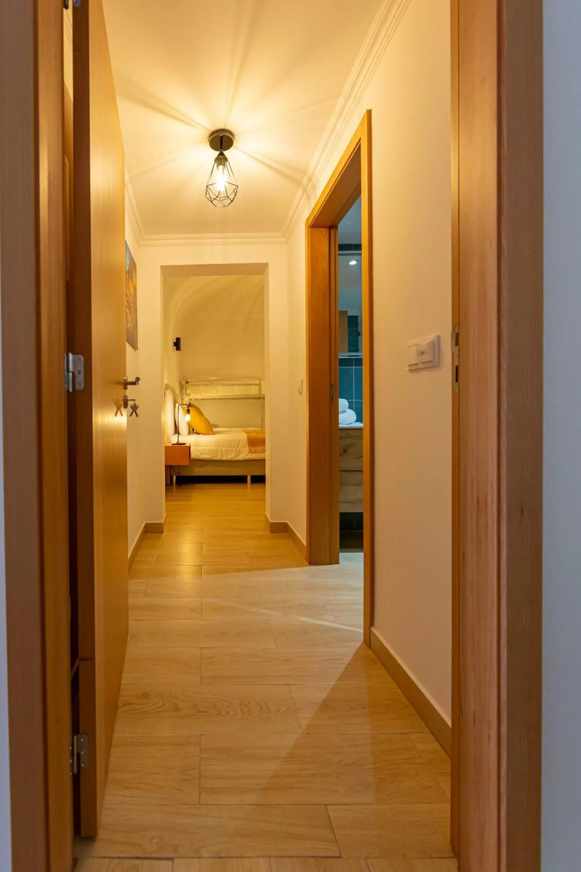 Bed, Bathroom in Luxury Palm Suites