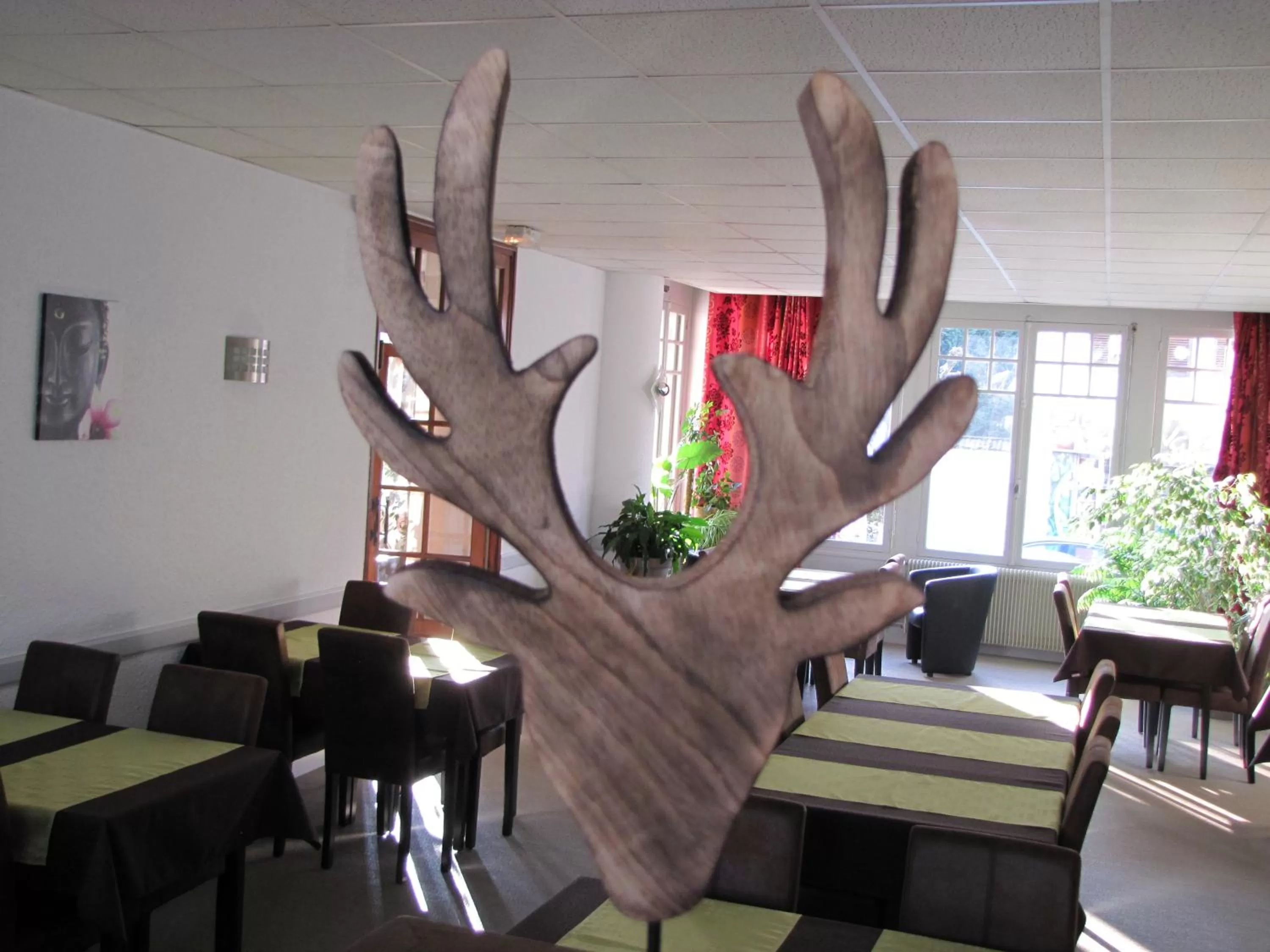 Living room in Logis Hotel Le Cerf