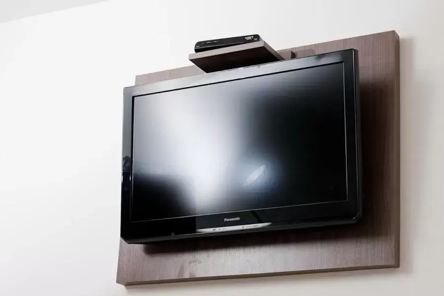 TV and multimedia, TV/Entertainment Center in Hotel Dois H