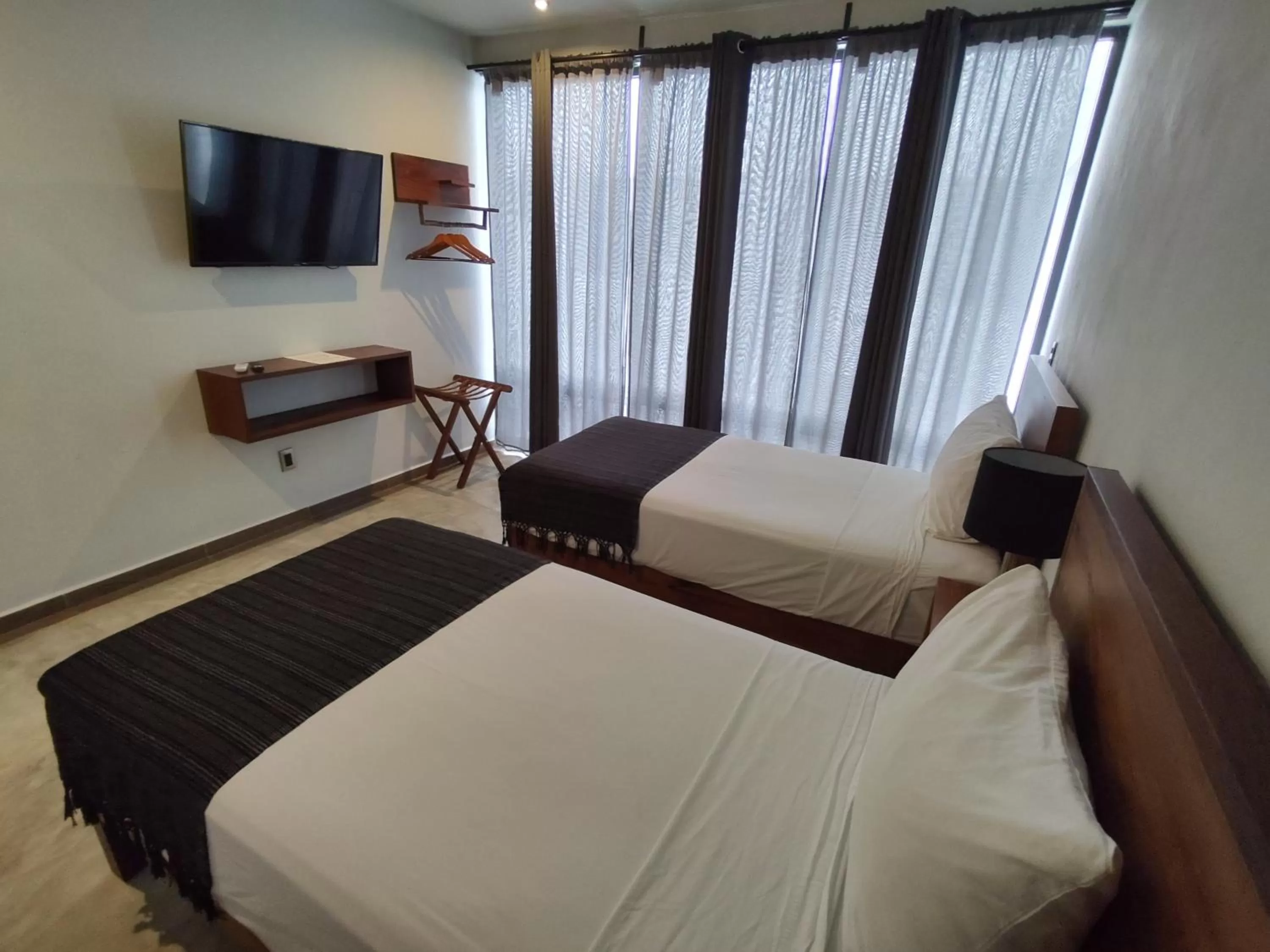 Bed in Hotel Muyu Tulum