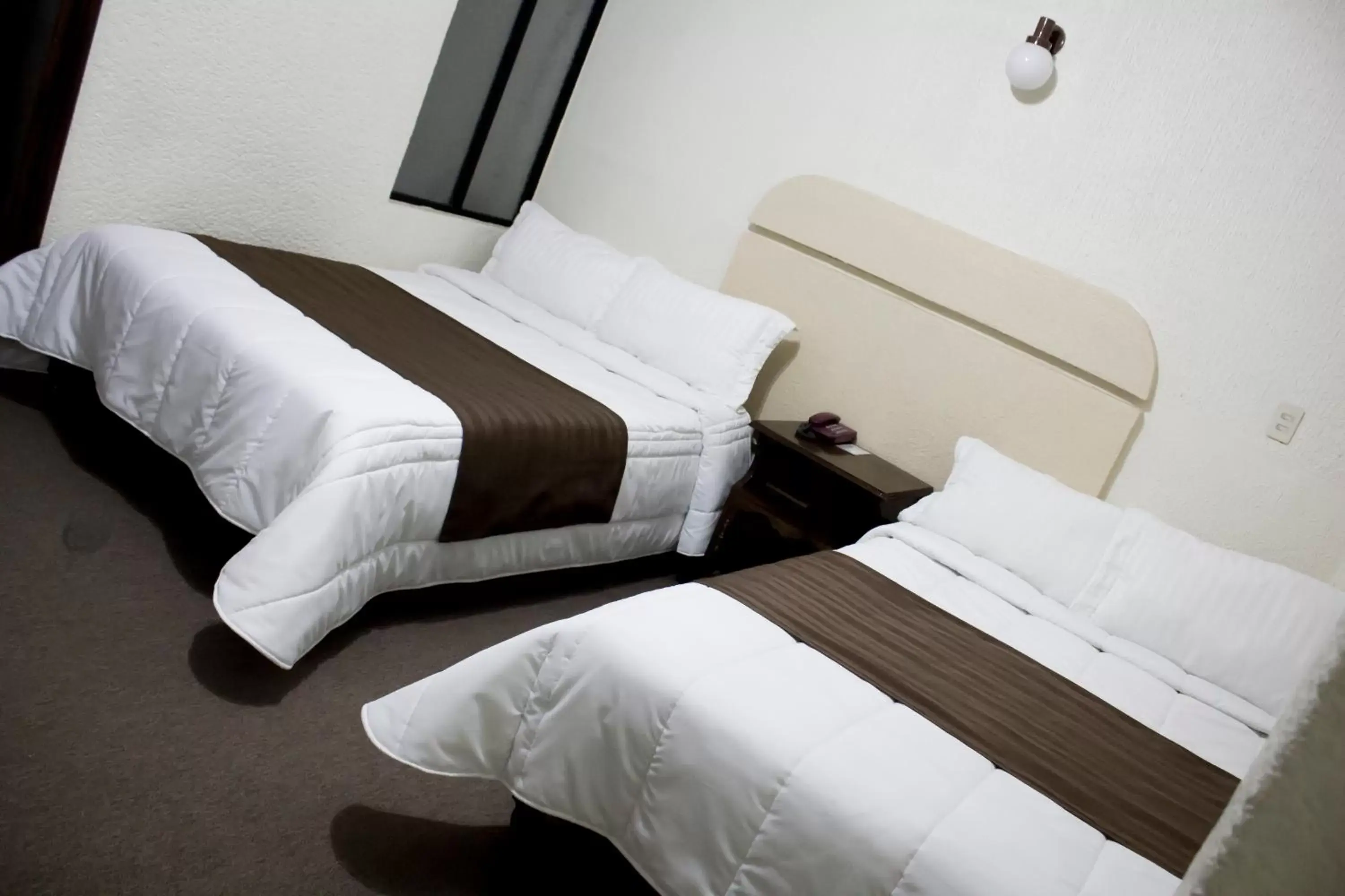 Bed in HOTEL ROMO