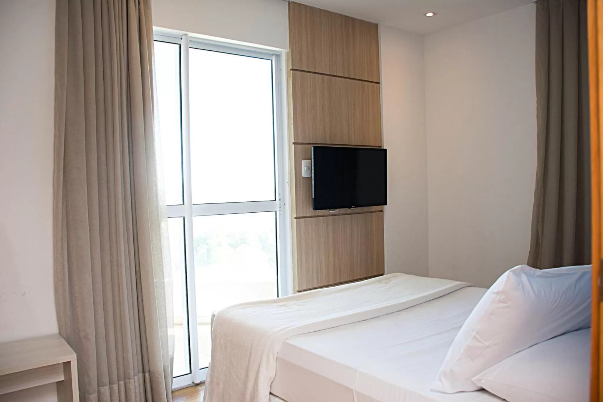 Bed in Unico Apart Hotel