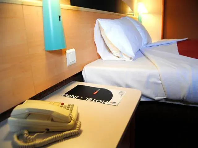 Bed in Hotel Iris Guadalajara