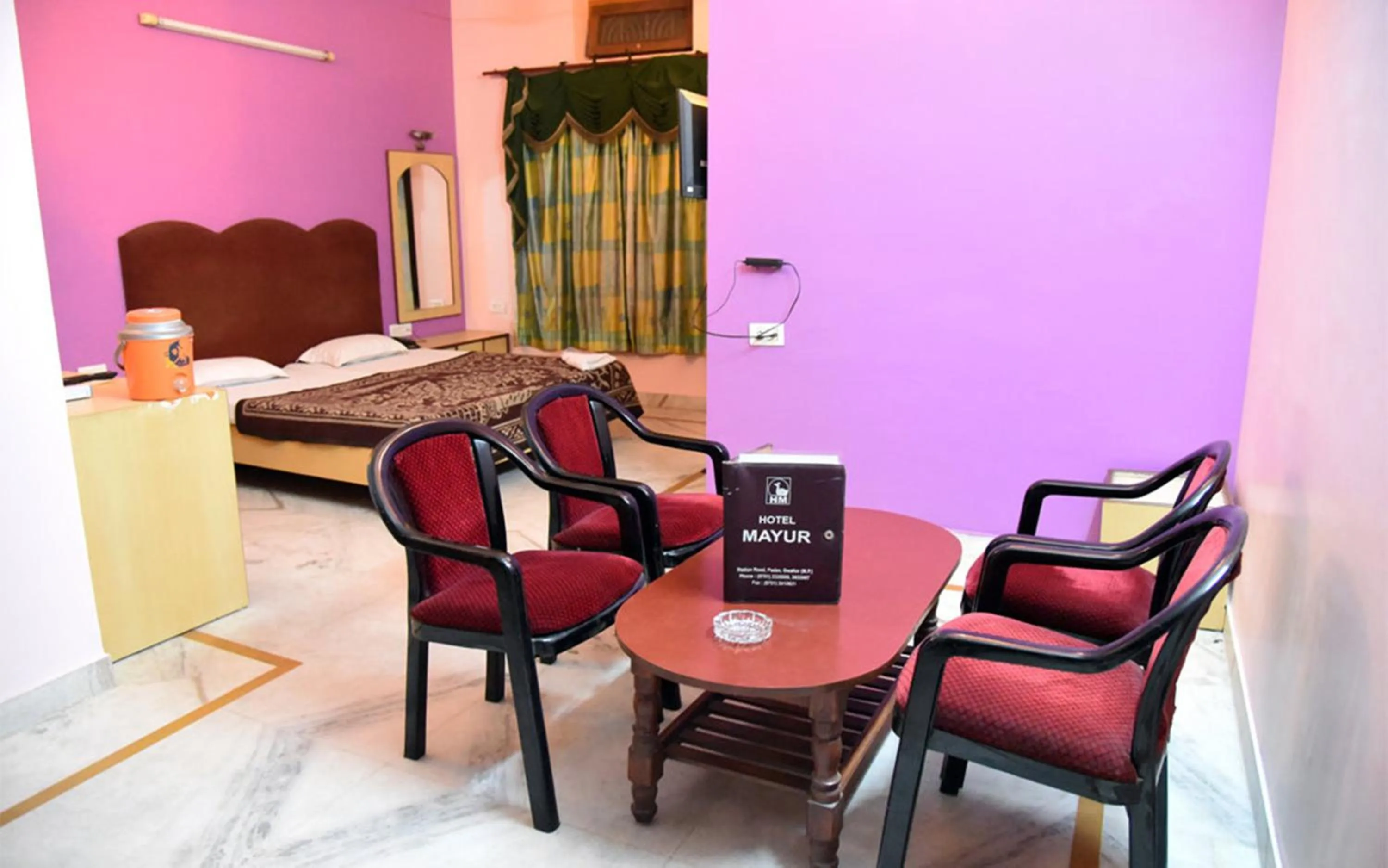 Seating area, Bed in Hotel Mayur