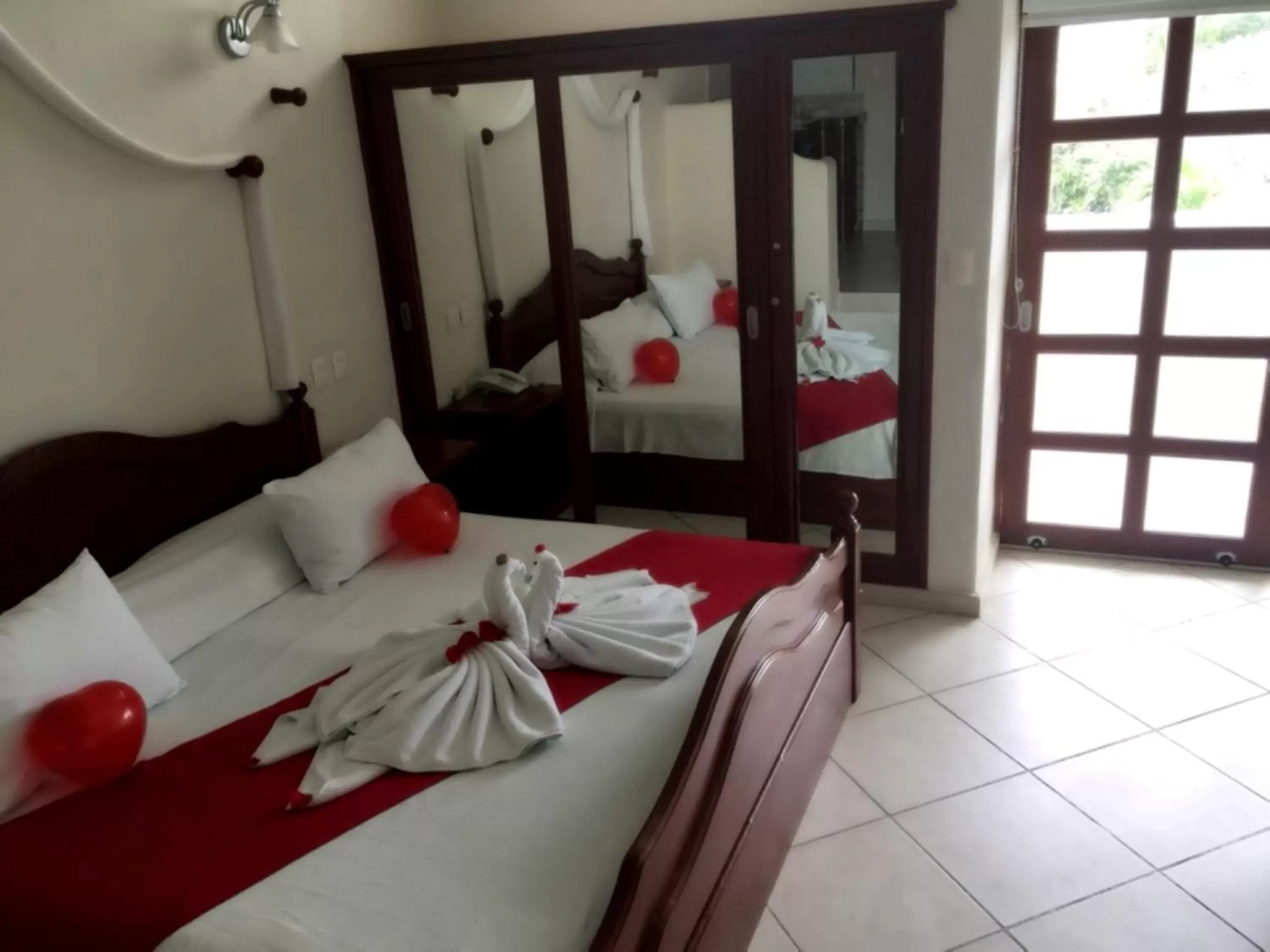 Bedroom, Bed in Villas Coco Resort - All Suites