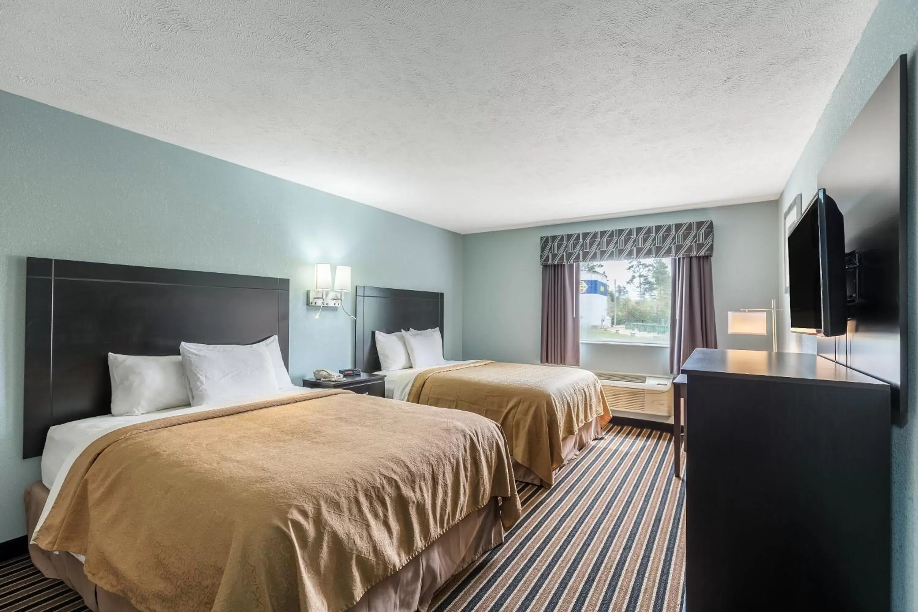 Queen Room with Two Queen Beds - Non-Smoking in Rodeway Inn