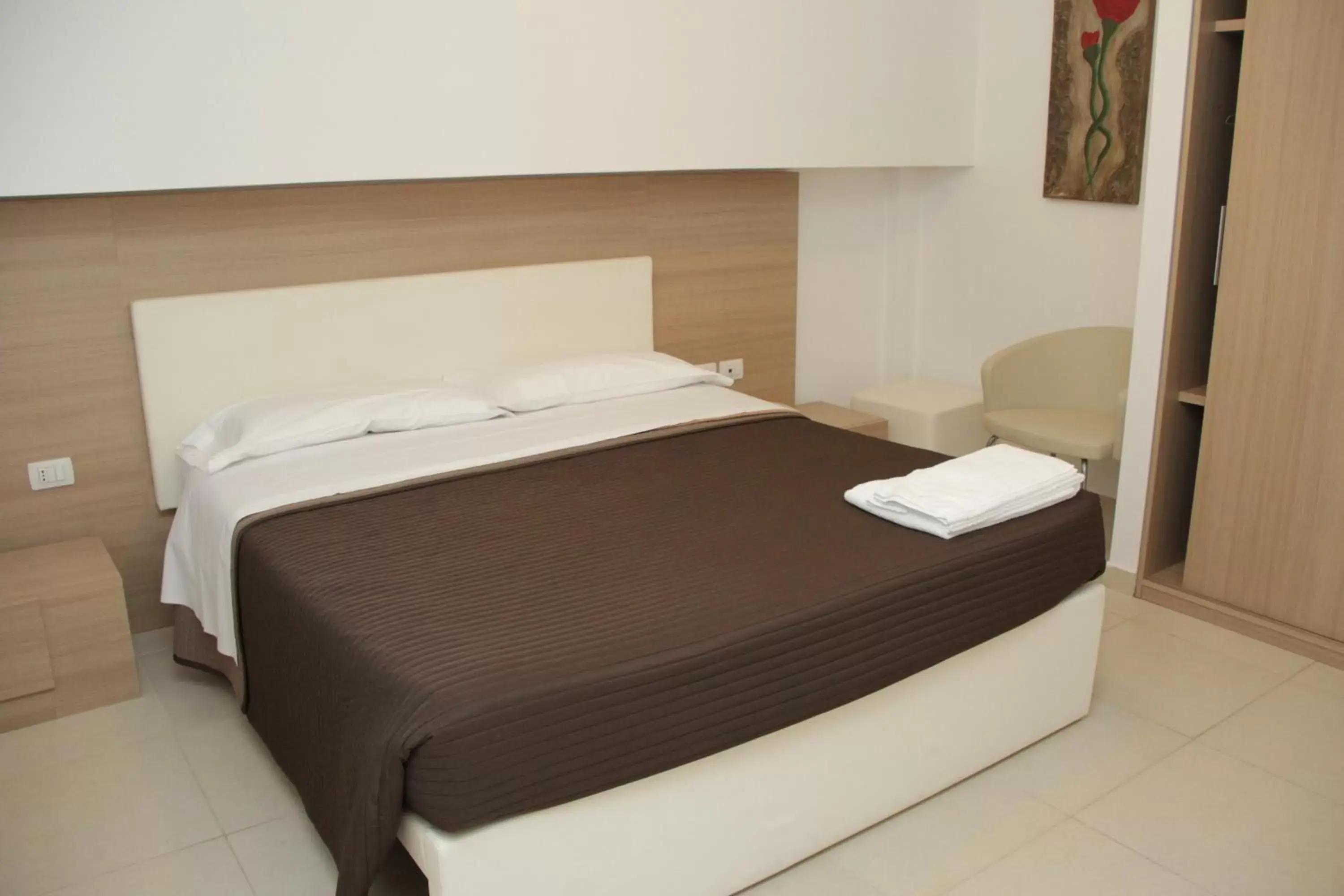 Bed in San Michele Apartments&Rooms