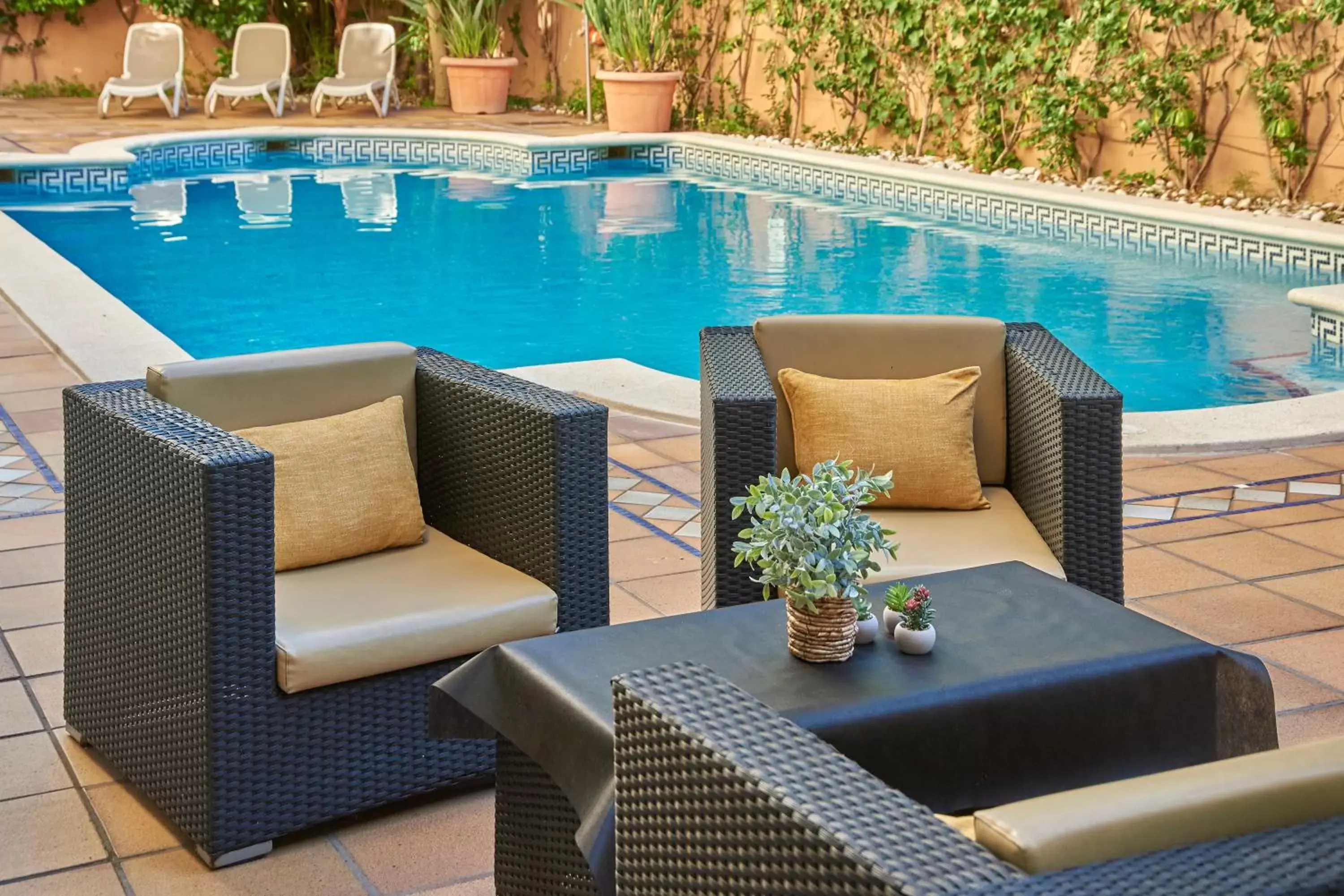 Swimming pool in URH Sitges Playa Swimming pool in URH Sitges Playa