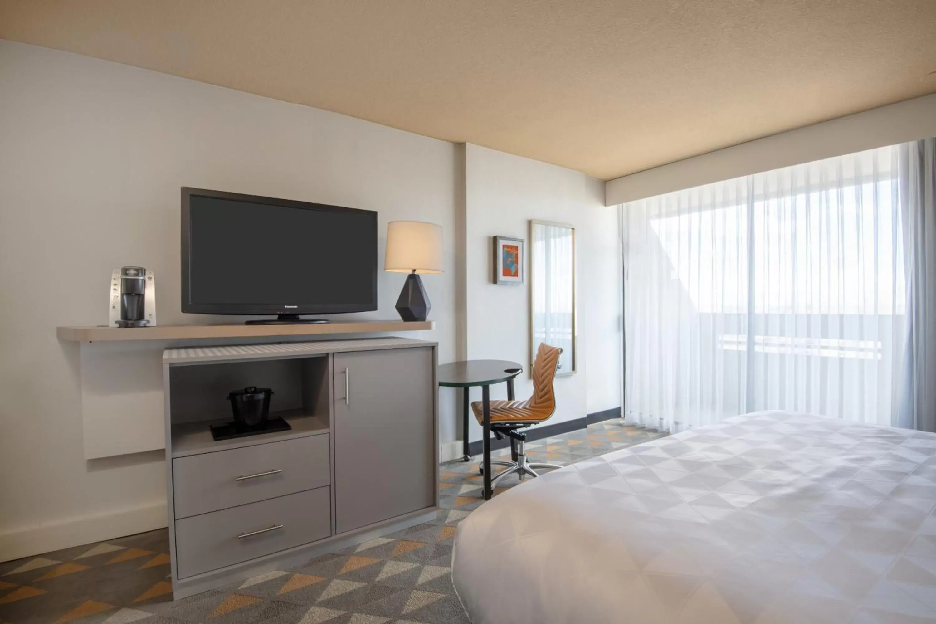 Photo of the whole room, TV/Entertainment Center in Holiday Inn Denver East, an IHG Hotel