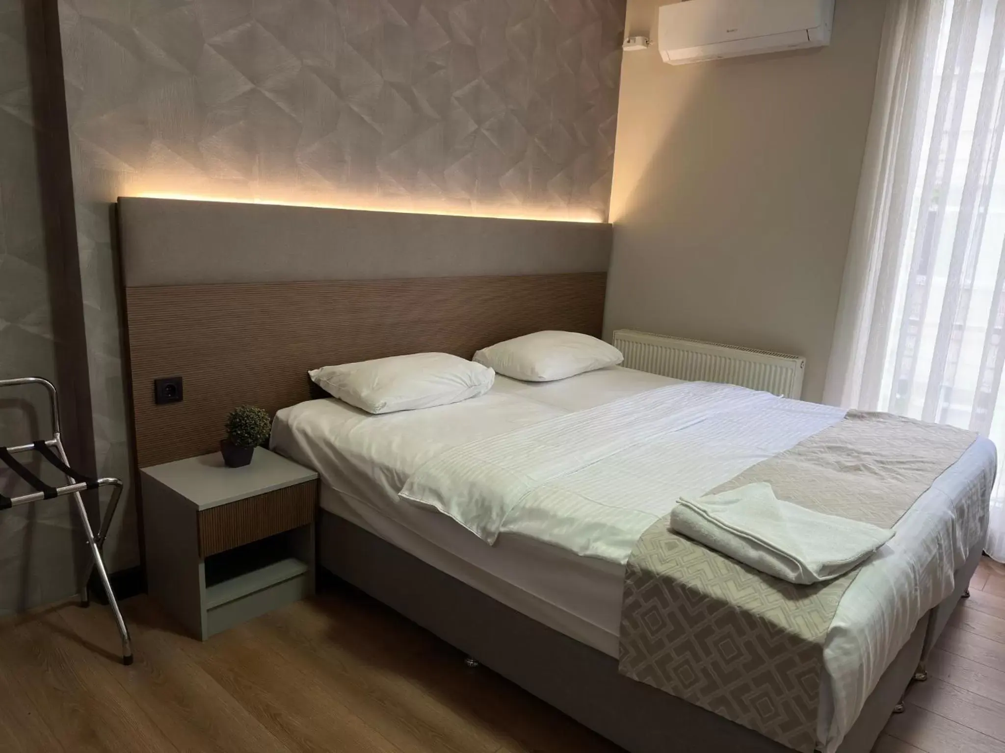 Bed in Niconya Port Suite&Hotel