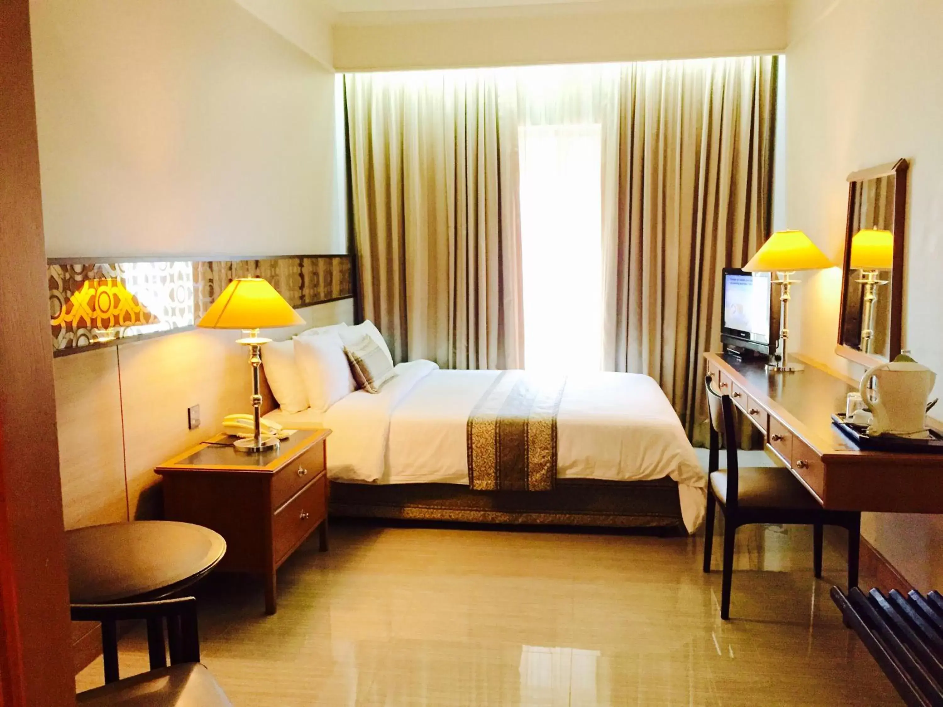 Photo of the whole room, Bed in Indra Regent Hotel