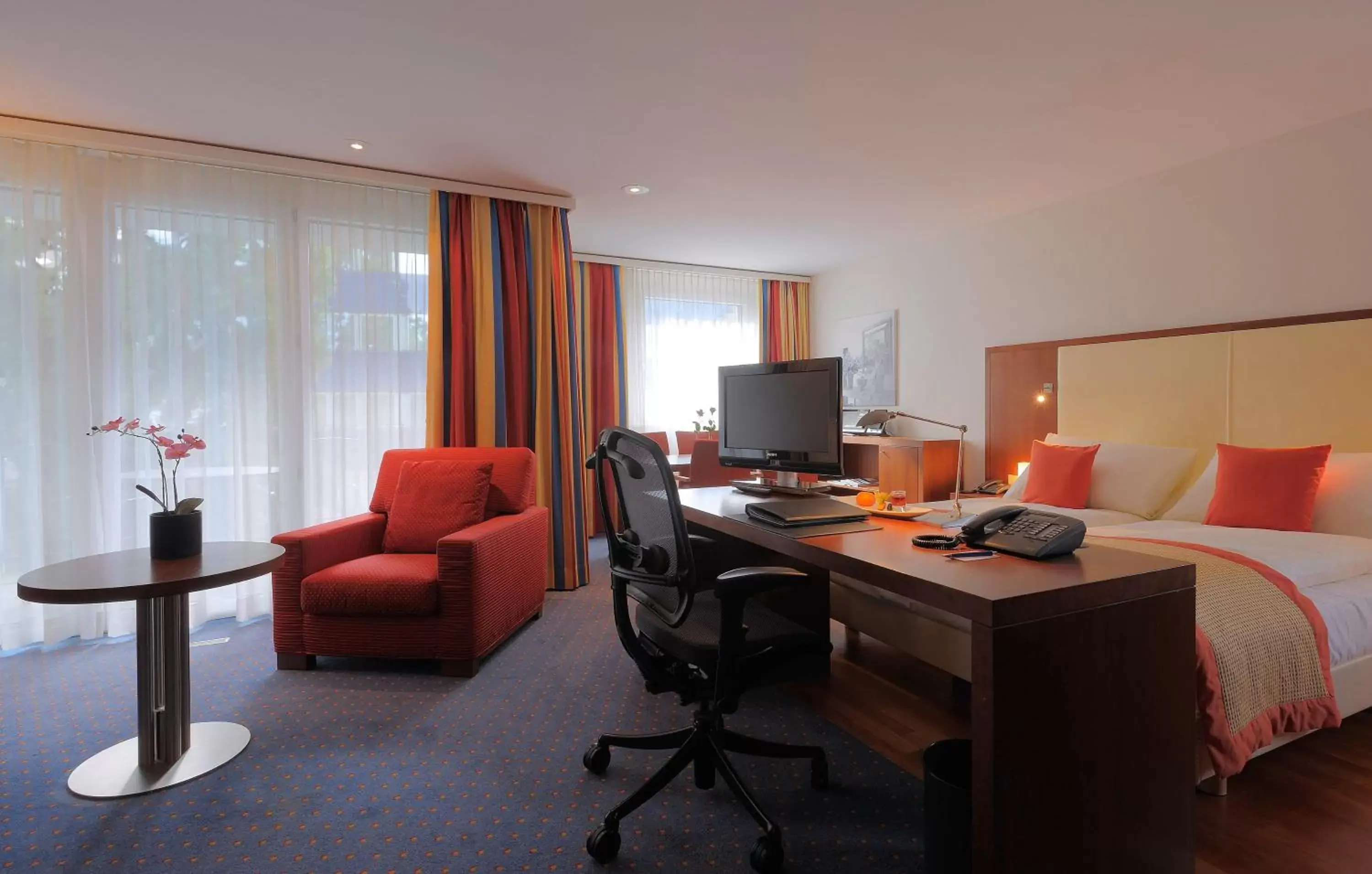 Photo of the whole room, TV/Entertainment Center in Radisson Blu Hotel, St. Gallen