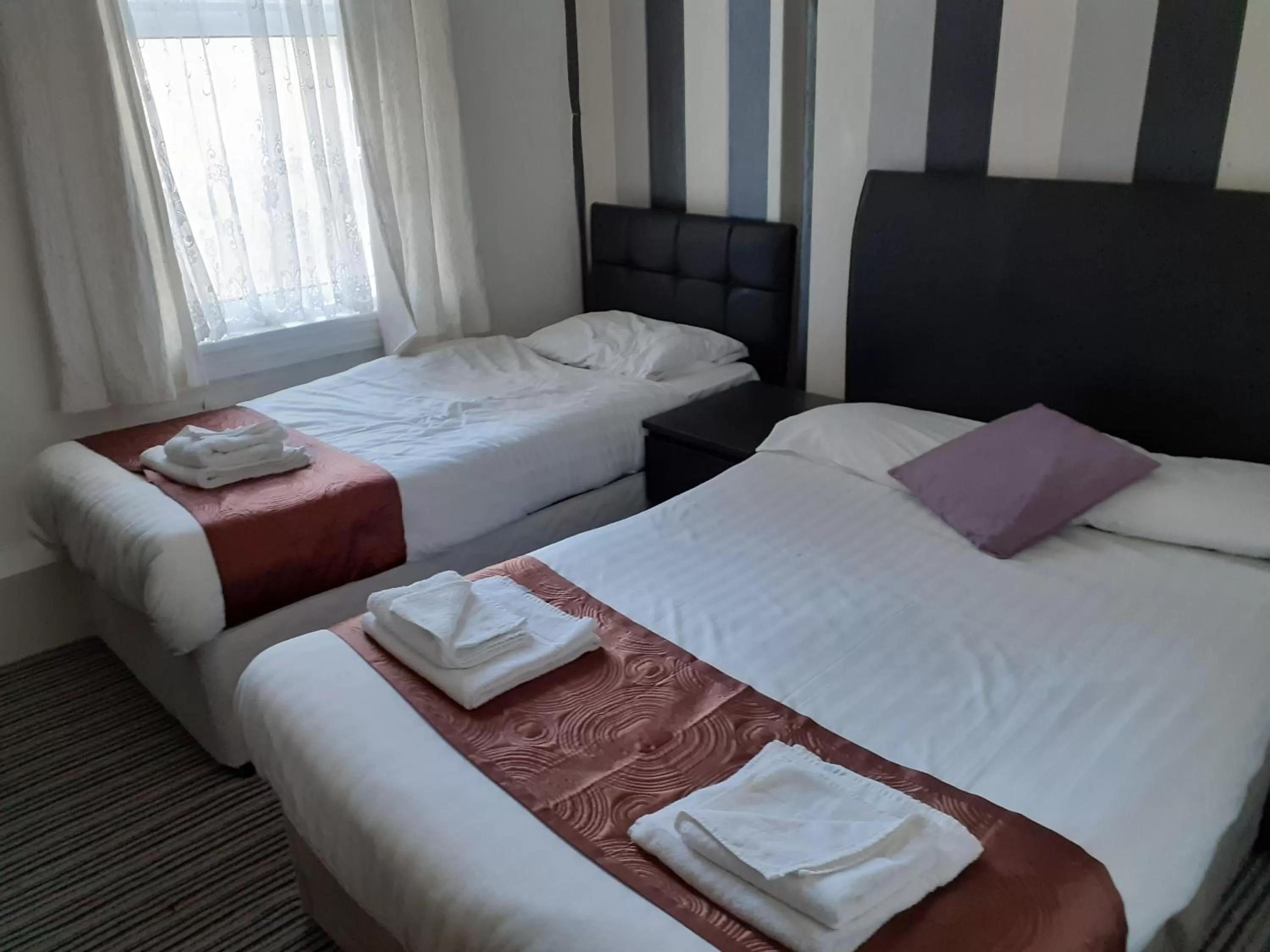 Bed in The Coastal Bay Hotel