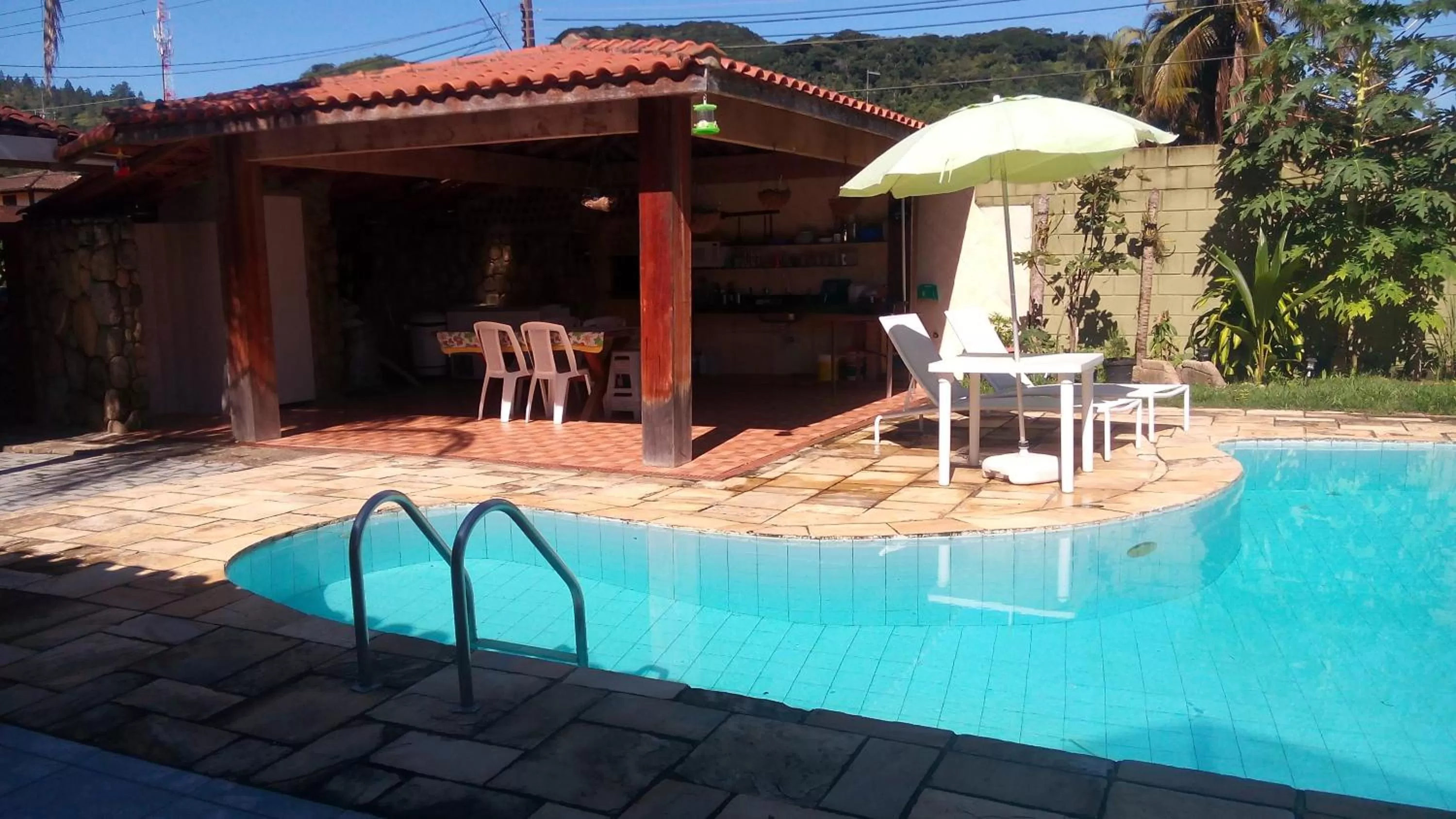 Swimming pool in Pousada Na Praia Ubatuba